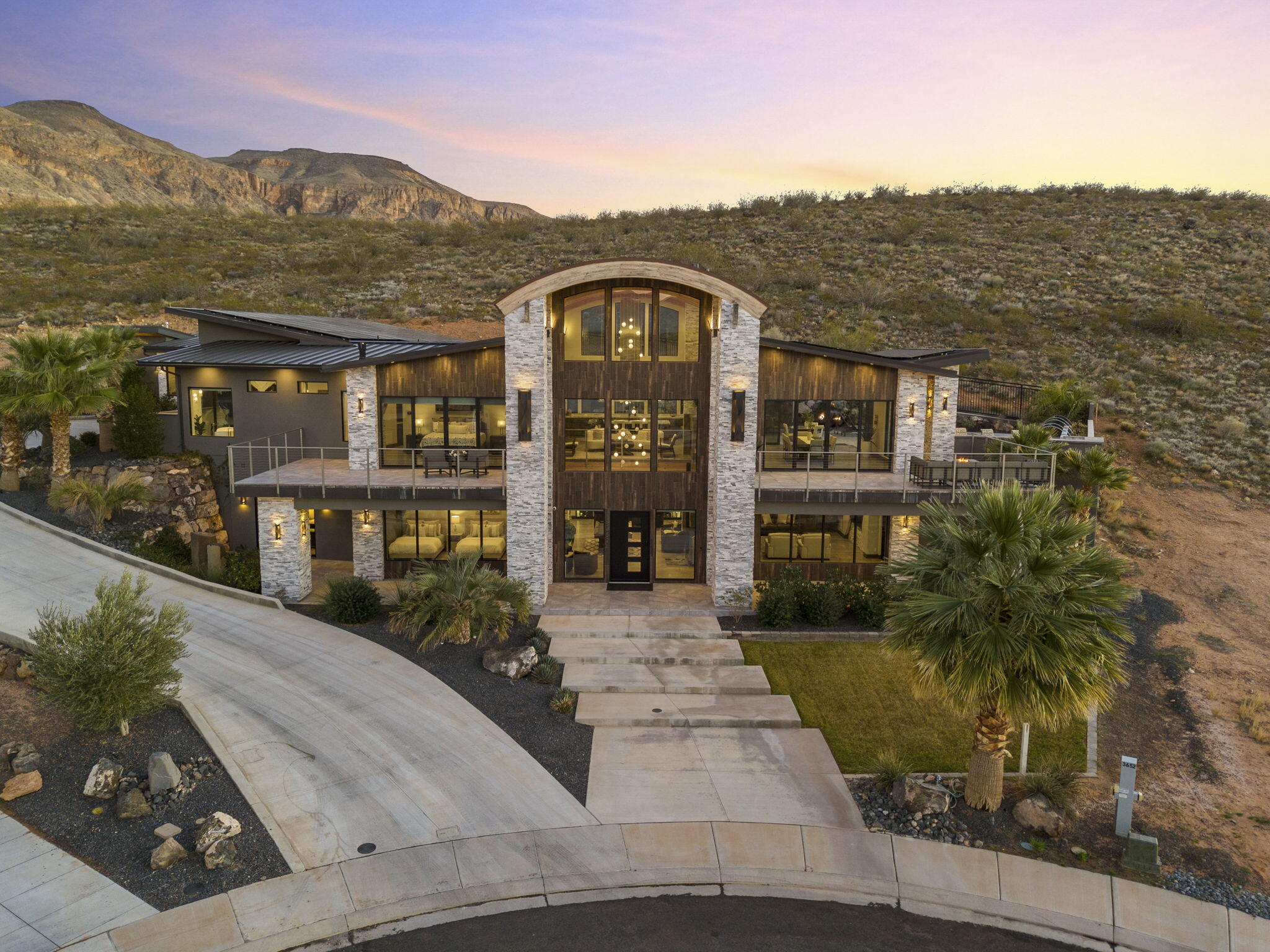 Former Parade Home located in the highly desirable Copper Rock master-planned golf community! This exceptional luxury home offers breathtaking views of Pine Valley Mountain and the Copper Rock Golf Course, while combining high-end finishes, resort-style amenities, and outstanding investment potential.

The gourmet kitchen is equipped with premium Thermador appliances and opens to spacious living and dining areas designed for entertaining. Every bedroom features its own en suite bathroom, providing privacy and comfort for family and guests. A custom wine cellar adds another touch of luxury.

The detached casita includes a private entrance, full kitchen, laundry, and living space, making it ideal for guests, multigenerational living, or additional rental flexibility.

Step outside to your private backyard oasis featuring a custom pool and spa with a dramatic waterfall flowing from the home, built-in BBQ, fire pit, and expansive covered patios--perfect for year-round outdoor living.

Additional features include an oversized 3-car garage, four washer and dryer sets, and a fully owned solar system for significantly reduced utility costs.

This property is fully zoned for nightly rentals and has a strong history of success on VRBO and other short-term rental platforms, offering an excellent opportunity for both personal enjoyment and income production.

Located just minutes from Sand Hollow Reservoir, Zion National Park, world-class golf, hiking, boating, and endless outdoor recreation, this home is ideal as a primary residence, second home, or investment property. Luxury, location, and lifestyle come together in one of Southern Utah's premier golf communities.
