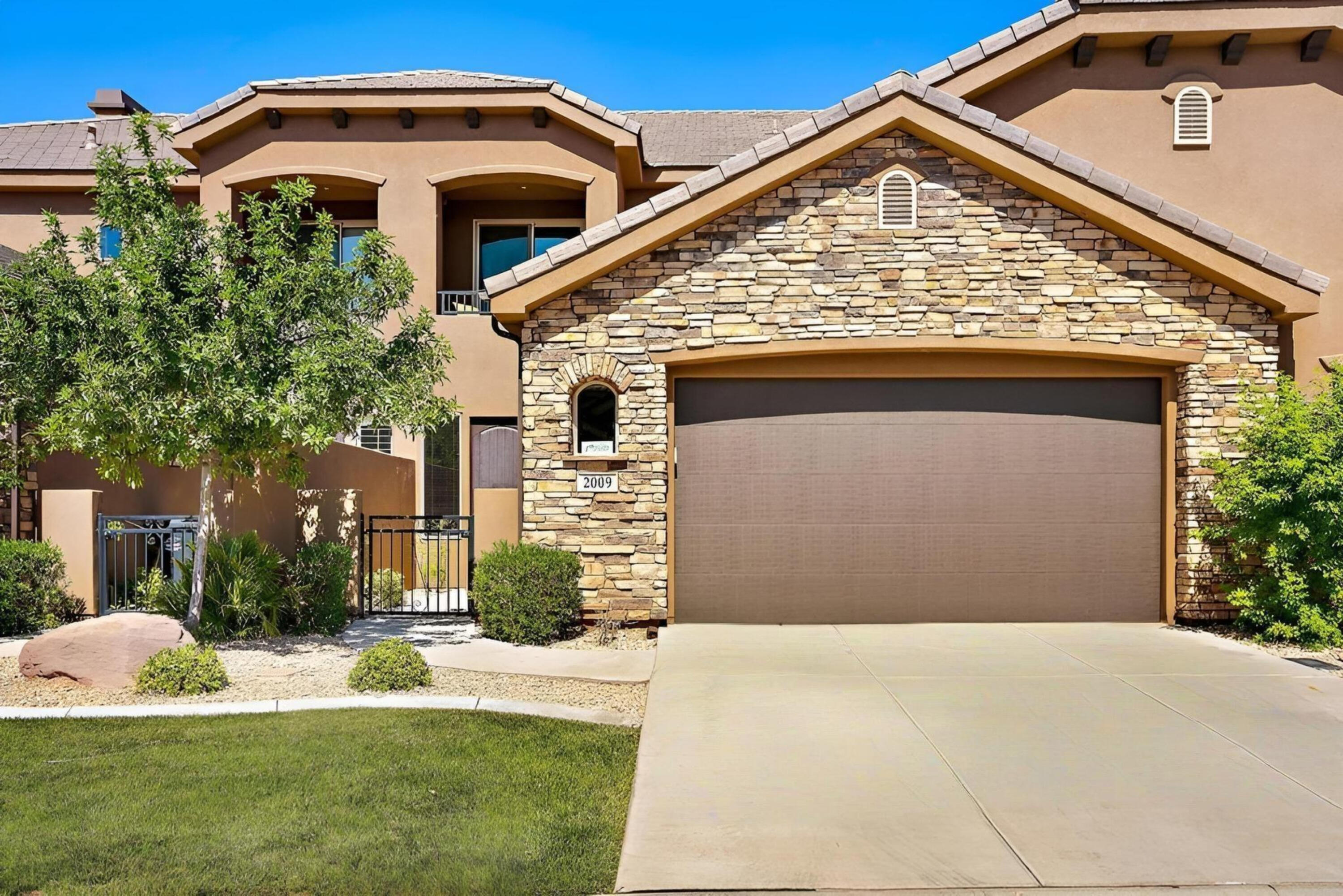 Welcome to 2009 N Coral Ridge Dr! This 2,594 sq. ft. masterpiece sits directly on Tee Box #5 of the Coral Canyon Golf Course. Take in the lush greens from your private balcony or private hot tub. Enjoy the grand kitchen and dual primary suites. Updated. New fridge and water heaters. This home comes FULLY FURNISHED and turn-key! Resort living includes two year-round heated pools, hot tubs, a fitness center, and a fishing pond--all just minutes from Zion National Park and Sand Hollow. Short-term Rental w/ flexibility: Pick your own property management company and maximize your ROI on this high-performing nightly rental. Whether it's a lucrative investment or a personal desert retreat, this property delivers.