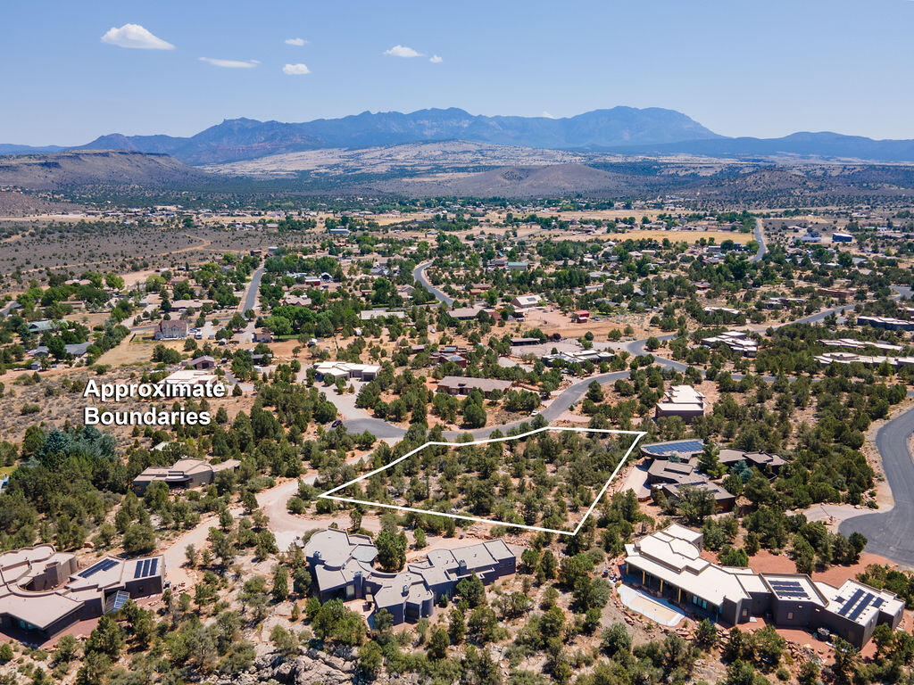 Lot 96 in phase 5 of Pinion Hills in Dammeron Valley, is 1.31 acres in size and offers panoramic views of Pine Valley Mountain. The dense trees, a rarity in the desert, create privacy. The land has a gentle slope, preserving the view corridors of the area. This is the perfect place for your new home. An enclave of homes just 20 minutes north of downtown St. George, Dammeron Valley is nearly 2,000' higher in elevation than the St. George valley, offering slightly cooler temps than the surrounding region. The sweeping views of Pine Valley Mountain are unbeatable. Pinion Hills is a collection of exclusive homesites and custom homes built in harmony with the topography and native vegetation. CC&Rs exist to preserve the character and quality of the neighborhood.