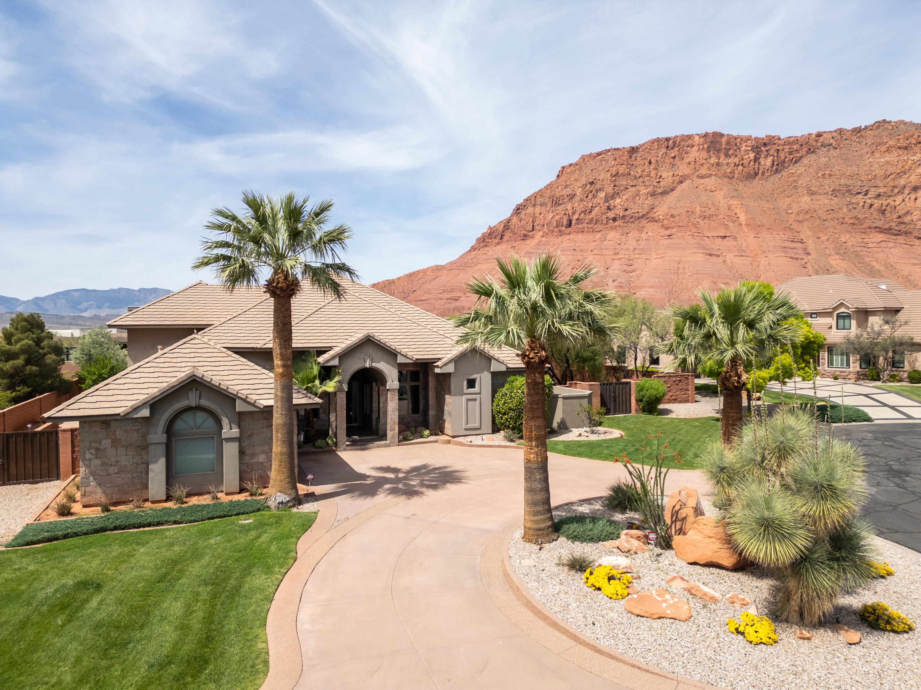 This property is a rare find. Located in the prestigious community of Citadel, in Ivins, Utah, and situated along a grand cul de sac.  An entertainer's dream home with an open floor plan on a well- appointed lush, .58 acre lot. 

This home offers world-renowned, breath-taking views of Snow Canyon State Park, Red Mountain, and Chancel Cliffs, and is a short drive to scenic Pine Valley.

You really have to see this 4 bedroom, 3.5 bathroom, 3,495 sq ft home to believe it. Especially when it comes to the luxurious primary bedroom wing with a large walk in closet and spa like bathroom.

Enjoy entertaining in this large gourmet kitchen, where you can gather in a second dining area.

A third en suite bedroom has its own spacious living room, as well as a sweeping balcony where you can enjoy fabulous views of the red mountains as well as the twinkling city lights of Ivins, Santa Clara, and St. George.

An additional treasure is its proximity to nearby outdoor activities, including Tuacahn Amphitheater (walking distance), Hiking and biking trails, ATV Trails, and luxury golf courses. 

You will find everything you could ever want in a custom home on a large, beautiful lot.
