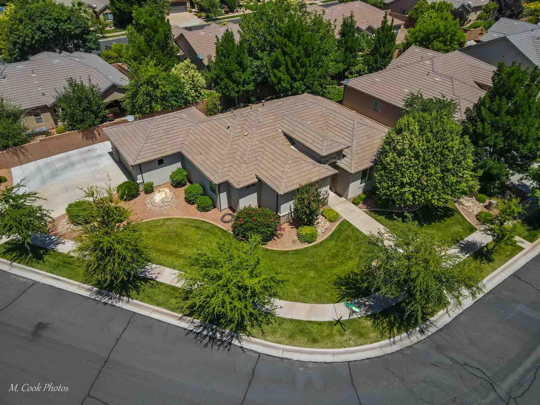 Completely remodeled and move-in ready! This beautiful single-level home shows like new and is tucked away in a quiet, established neighborhood just off Dixie Drive, offering convenient access to shopping, dining, schools, and all that St. George has to offer.

Inside, you'll find a stunning remodeled kitchen, an updated fireplace, modern finishes throughout, and durable tile and wood flooring with carpet only in master closet. The spacious floor plan features 3 bedrooms, 2.5 bathrooms, and comfortable living spaces designed for both everyday living and entertaining.

The 3-car garage includes a tandem third bay, fresh paint, and its own mini-split system, making it ideal for a workshop, home gym, hobbies, additional storage, or room for toys.

Situated on a desirable corner lot, the property offers mature landscaping, a private backyard, and a peaceful setting that is hard to find. With no HOA, single-level living, and a turnkey remodel, this home combines comfort, convenience, and flexibility in one of St. George's most established neighborhoods.

Vacant and easy to show!