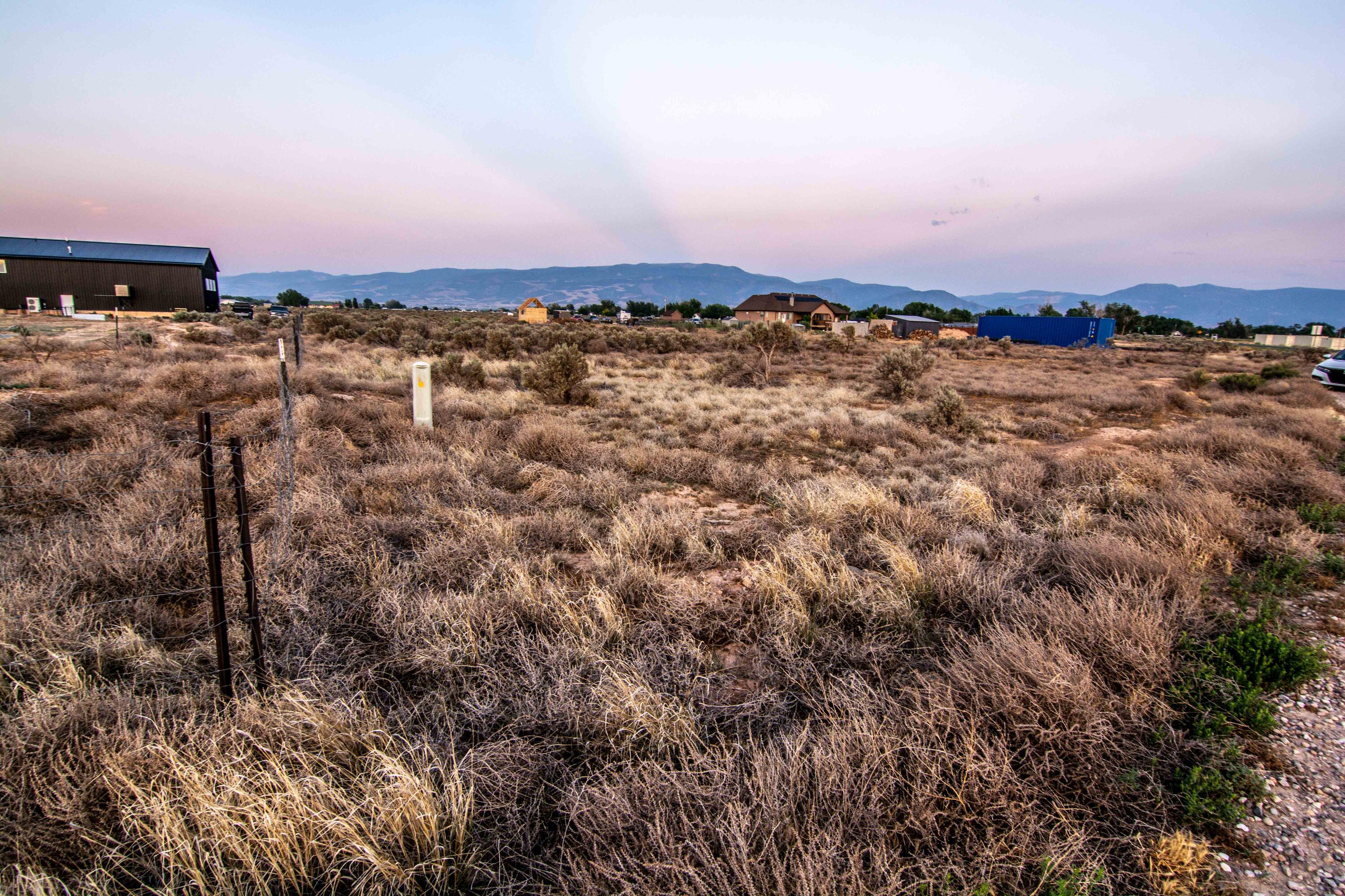 Discover this spacious 0.89-acre lot off Lund Hwy offering wide-open skies, mountain views, and the peaceful atmosphere Southern Utah is known for. With nearly an acre of land and electricity in the street, there's ample room for a custom home, animal rights, RV parking, recreational vehicles, and plenty of outdoor living spaces.