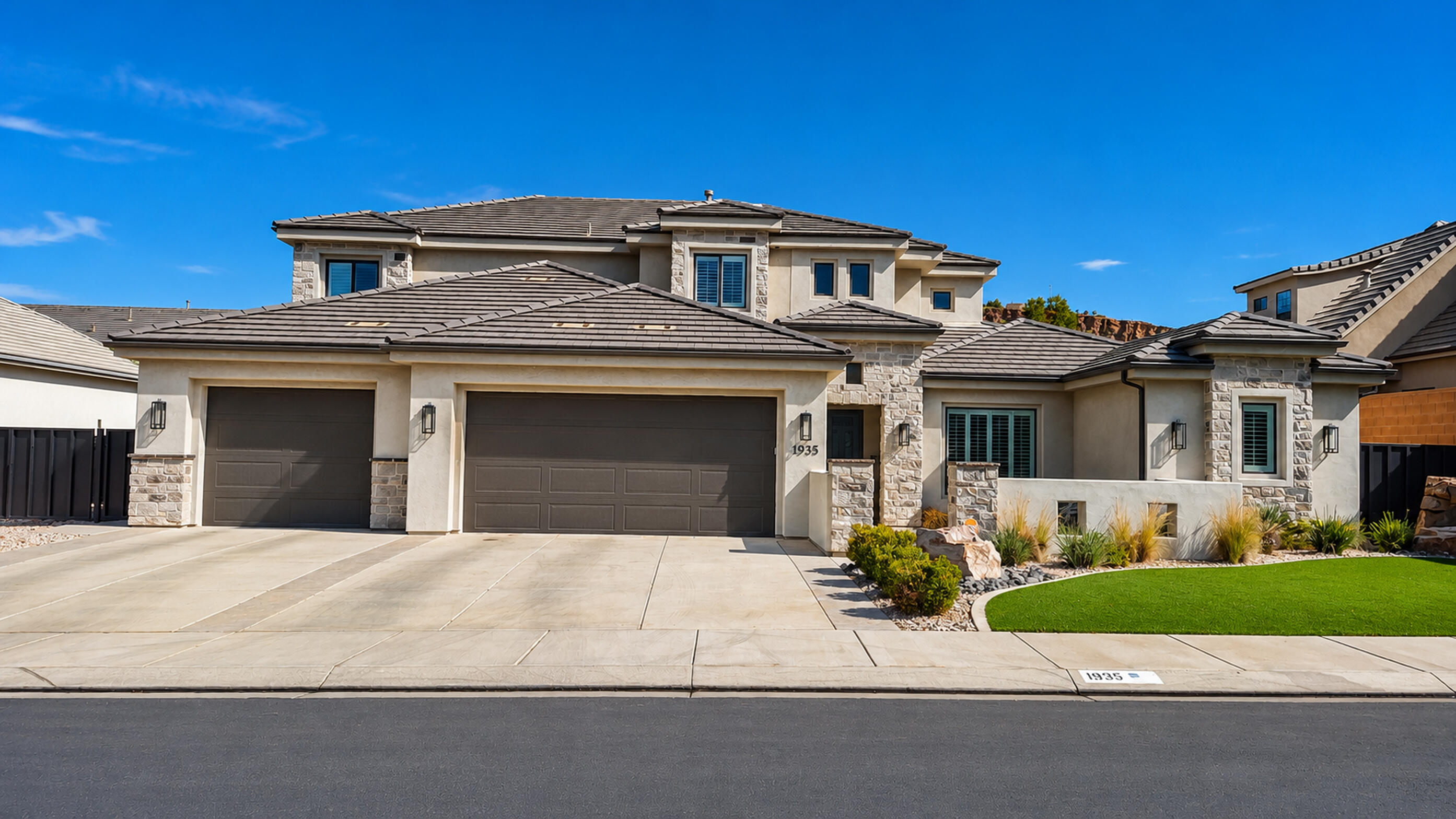 This stunning two-story modern home has been exceptionally designed with both functionality and style! Situated on an oversized lot it features full front and backyard landscaping, a cozy fire pit, covered dining and lounge areas, a recreation space, generous RV parking, and a large multi-purpose concrete pad. Ample room to add a pool, casita, or detached garage! Inside, the main level offers two living areas, a spacious primary suite, a flex space that can be used as a home office, den, or private gym, and a mudroom and laundry area with plenty of storage. Custom lighting, beautiful millwork, and plantation shutters throughout this home give every space character and warmth.  The bright open kitchen features an abundance of prep space, custom cabinetry, designer vent hood, quartz counter tops, and a built in refrigerator and freezer. Upstairs you will find four generously sized bedrooms and a media/bonus room.  This home offers exceptional space for both indoor and outdoor living!