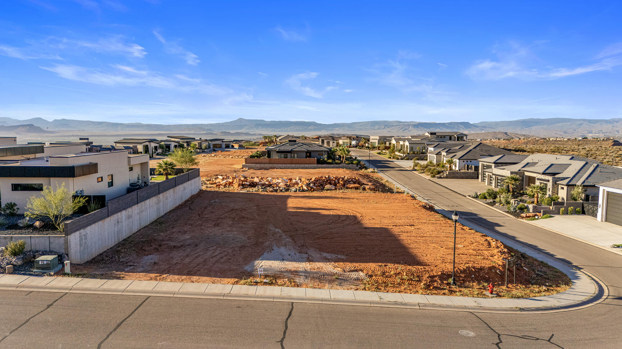 Discover the perfect canvas for your dream home in the prestigious, gated community of Westgate Hills. This rare 0.38-acre pad-ready lot offers a seamless start to building, saving you time and expense while allowing you to focus on designing the home you've always envisioned. Nestled in the highly sought-after Green Springs area, this property captures truly breathtaking mountain views and stunning desert landscapes that define Southern Utah living at its finest. 

Westgate Hills is known for its upscale homes, quiet surroundings, and secure gated access, offering both exclusivity and peace of mind. Whether you're looking to build a full-time residence or a second home retreat, this lot provides the perfect blend of tranquility and convenience.

Located just minutes from some of the area's best amenities, you'll have easy access to premier golf courses, scenic hiking and biking trails, and a variety of dining and retail options. Enjoy the balance of a serene neighborhood setting while still being close to everything you need.

Opportunities like this are becoming increasingly rare--especially pad-ready lots in such a desirable location. Don't miss your chance to secure one of the last remaining homesites in Westgate Hills and bring your vision to life in one of the most beautiful and established communities in the Green Springs area.