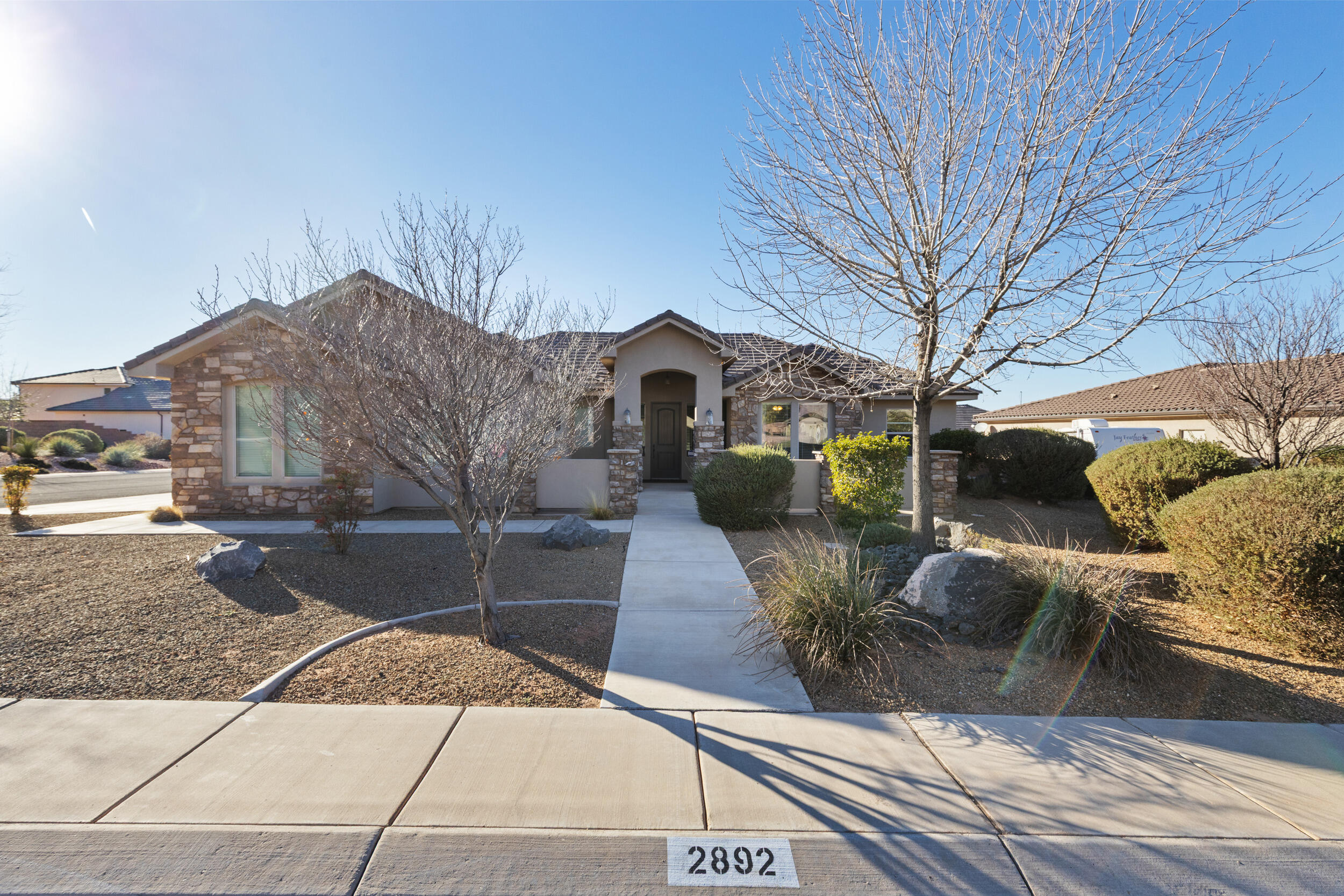Adventure meets comfort in this beautiful 3-bedroom, 3-bath home in the highly sought-after Dixie Springs neighborhood. Located just minutes from Sand Hollow Reservoir, Sand Hollow Resort & Golf Course, Jellystone RV & Water Park, and miles of side-by-side trails, this home offers the best of Southern Utah living. Lightly used as a second home, it feels brand new and has been meticulously cared for. Large windows fill the space with warm natural light, creating a cozy, inviting atmosphere. Enjoy an open, functional layout with a private casita for guests, a 3-car garage with room for toys, and a like-new hot tub to relax under the stars.