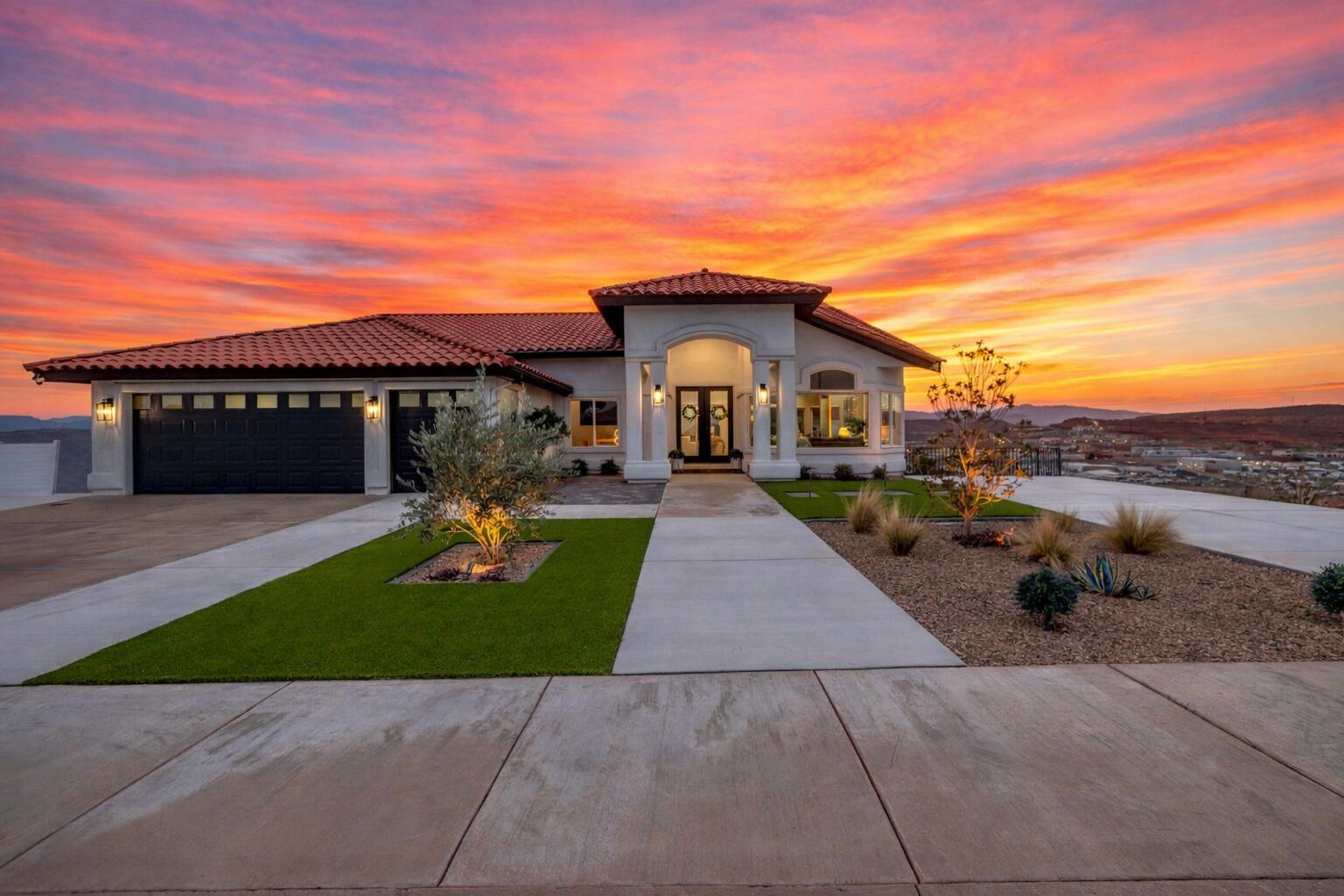Welcome to this beautifully upgraded home in the desirable Eastridge area of St. George, Utah.
This expansive residence offers a thoughtfully designed floor plan with numerous high-end upgrades throughout, making it ideal for both everyday living and entertaining.
Vaulted ceilings and large windows fill the home with natural light while showcasing breathtaking panoramic mountain and valley views. The main level features a spacious primary suite, multiple living areas, and a stunning chef's kitchen complete with high-end appliances, a built-in refrigerator and freezer, and quartz countertops with a dramatic waterfall island that anchors the space beautifully. The fully finished basement adds exceptional functionality and value, featuring a custom built-in entertainment area.