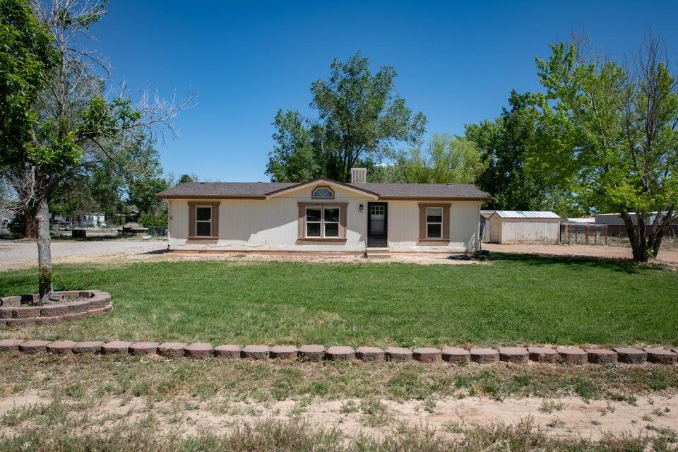 This manufactured home on .53 acre has had extensive updating and there's an entire list of improvements including a completely renovated kitchen and master bathroom. Kitchen includes wall to wall cabinets, new countertops, double oven, farmhouse sink with new faucet, tile backsplash complete with new garbage disposal. New lighting throughout the home. Custom electric fireplace that was wired for tv above the mantle. New front door with new screen door and new lighting both back and front door. Can lights were added in the living room to brighten up the space. Exhaust fans in bathrooms were replaced and smoke alarms added. New tile flooring in the kitchen, dining room, hallways, and bathrooms. The list goes on and on. Only being sold due to job relocation. BONUS! FULL RV HOOKUP!