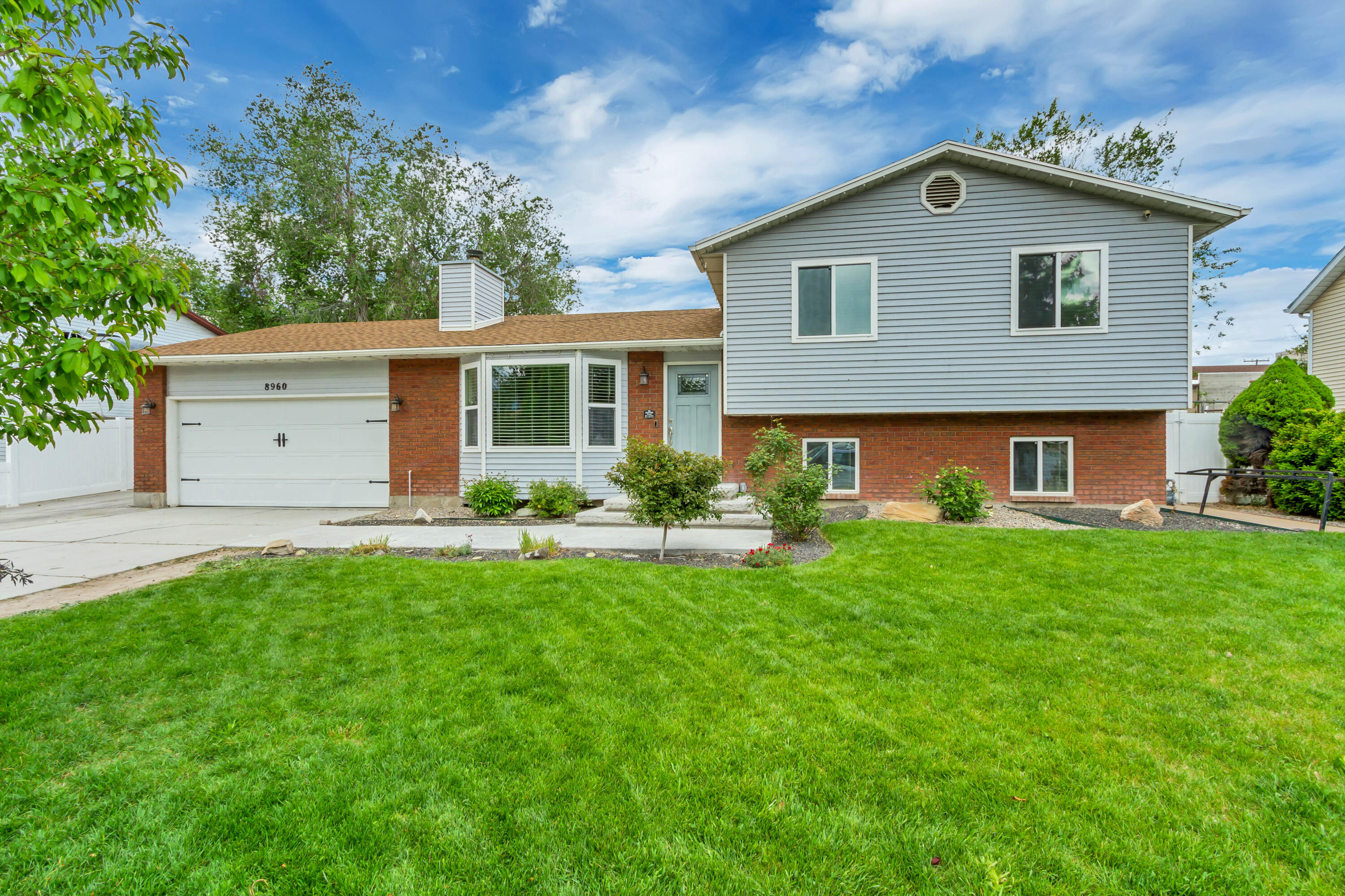 Completely renovated tri/multi-level home with thoughtful updates throughout and a spacious layout offering 4 bedrooms and 2 bathrooms. Major improvements include new windows, HVAC, A/C, electrical, plumbing, flooring, kitchen, bathrooms, lighting, and finishes throughout. Kitchen refreshed in 2026 with updated cabinetry, countertops, and modern finishes. The open-concept main level features a bright living area with a sleek fireplace. Spacious backyard with a full concrete patio, mature trees, storage shed, and new fully fenced vinyl fencing. Located near Veterans Memorial Park with convenient access to Redwood Rd, South town Mall for shopping, restaurants, and everyday amenities. Zoned for Riverside Elementary, West Jordan Middle School, and West Jordan High School with NO HOA.
