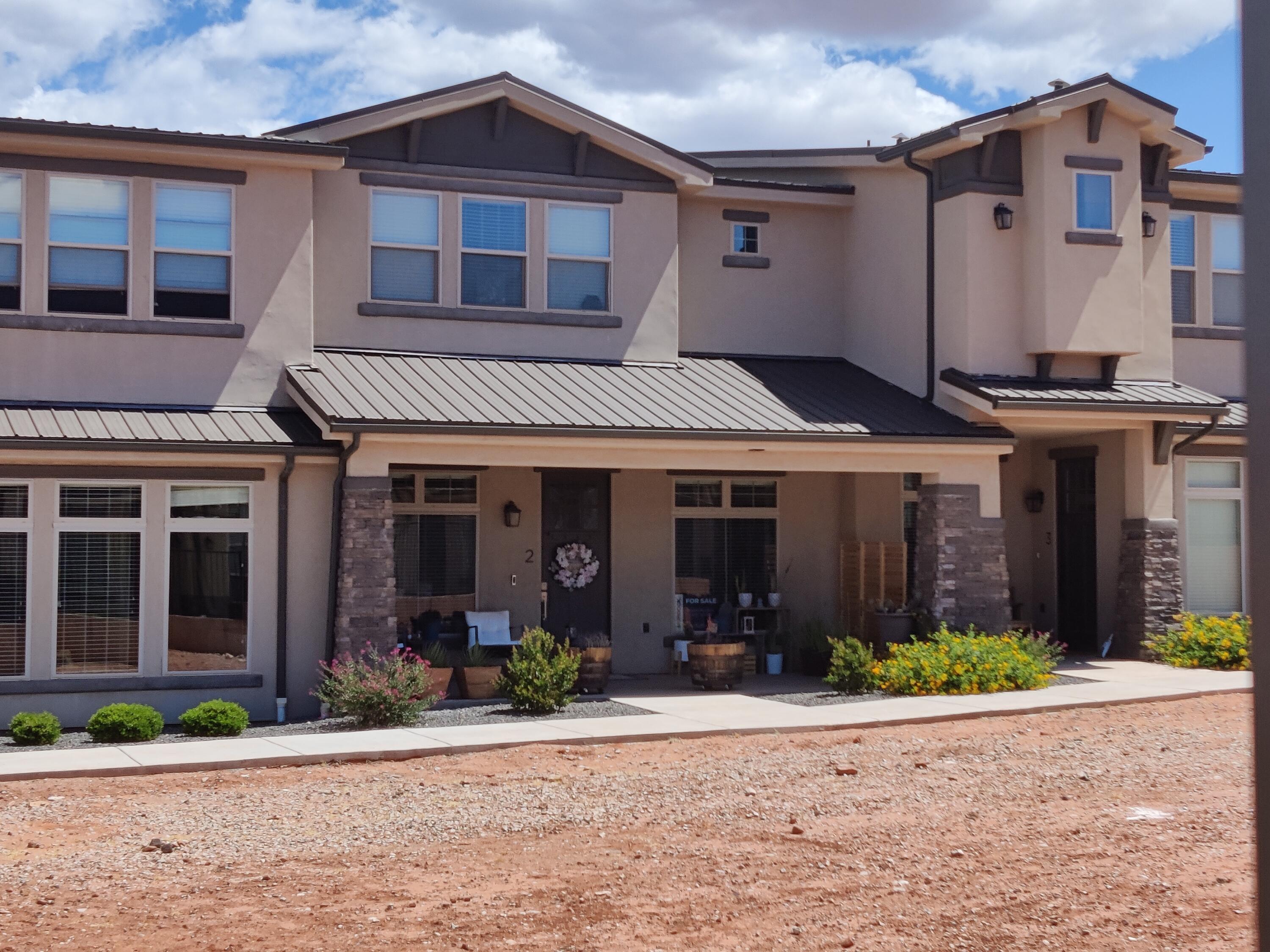 This is the best-priced townhome in Sage Villas -- and it delivers. Surrounded by the beautiful scenic red mountains and desert landscape views. Three bedrooms, two and a half baths, 1,767 square feet with a large loft that flexes to whatever you want; Office, bonus room, extra storage. The epoxy garage floor, covered front patio, and quality finishes throughout give it a polished feel without the inflated price tag and low HOAs. Ivins is one of the most in-demand areas in Washington County, and at this number, this one won't sit long.