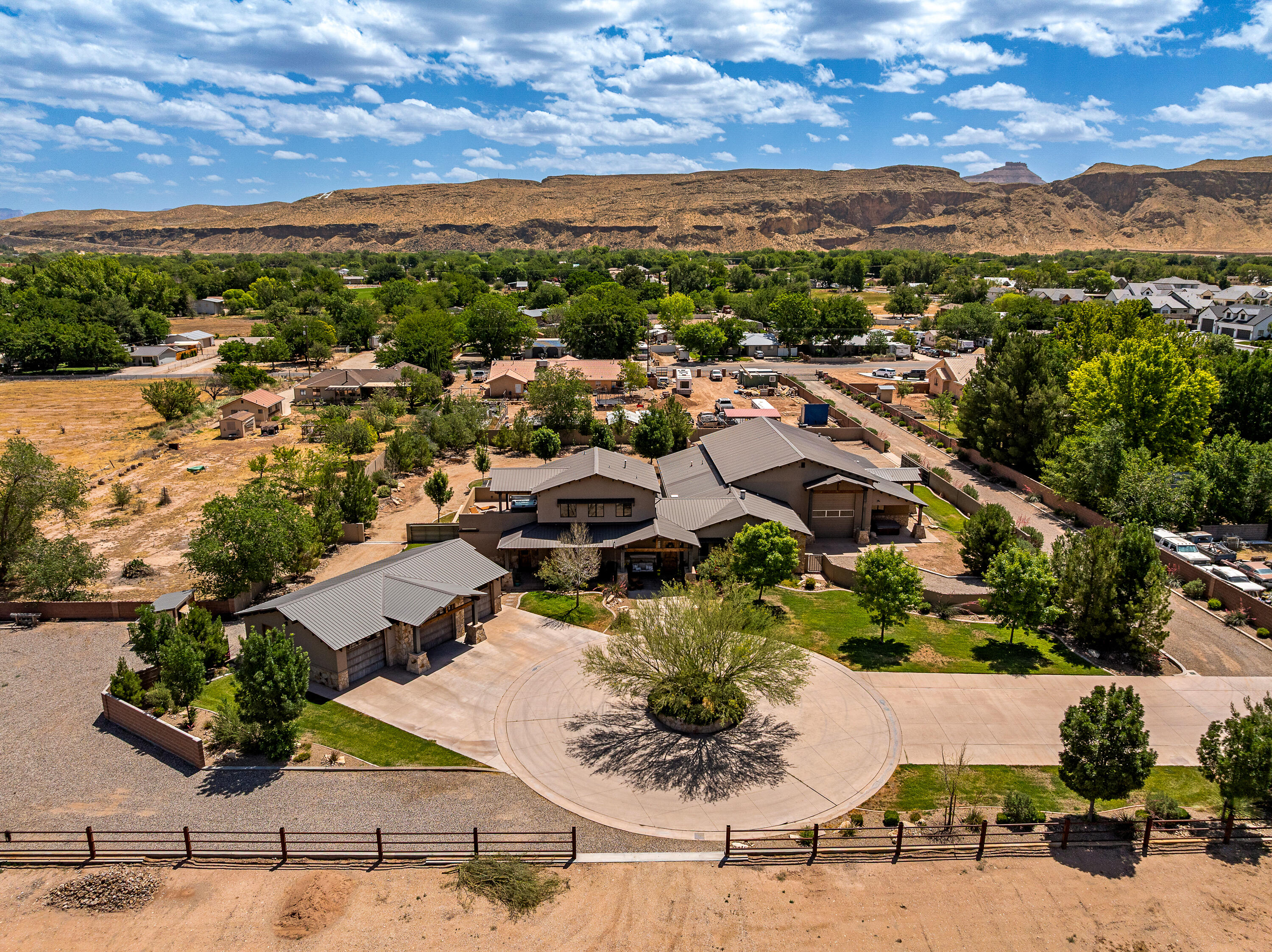Set on 2.83 private acres in the heart of Hurricane, this exceptional horse property captures breathtaking Pine Valley Mountain and red rock views while offering a rare combination of luxury, privacy, and functionality. Surrounded by mature landscaping and open space, the property feels like a private retreat while remaining just minutes from town.

Inside, you'll find over 4,300 square feet of thoughtfully designed living space featuring real hardwood flooring, premium finishes, tall ceilings, and expansive windows.The chef's kitchen is a true centerpiece, appointed with high-end Thermador appliances, custom cabinetry, generous prep space, and an inviting layout designed for both everyday living and entertaining.

The private casita offers its own kitchen, living area, bedroom, and bathroom, providing the perfect setup for guests, extended family, or private accommodations.

For those seeking space for vehicles, toys, hobbies, or business use, the property delivers with an incredible pull-through shop and garage space capable of housing 7+ vehicles, in addition to the attached garage. Whether you're a car enthusiast, horse owner, or simply value room to spread out, this property offers possibilities rarely found in today's market.

With horse property zoning, 1 acre foot of valuable water rights, stunning views in every direction, premium construction, and unmatched privacy on nearly three acres, this is a truly one-of-a-kind Southern Utah estate.