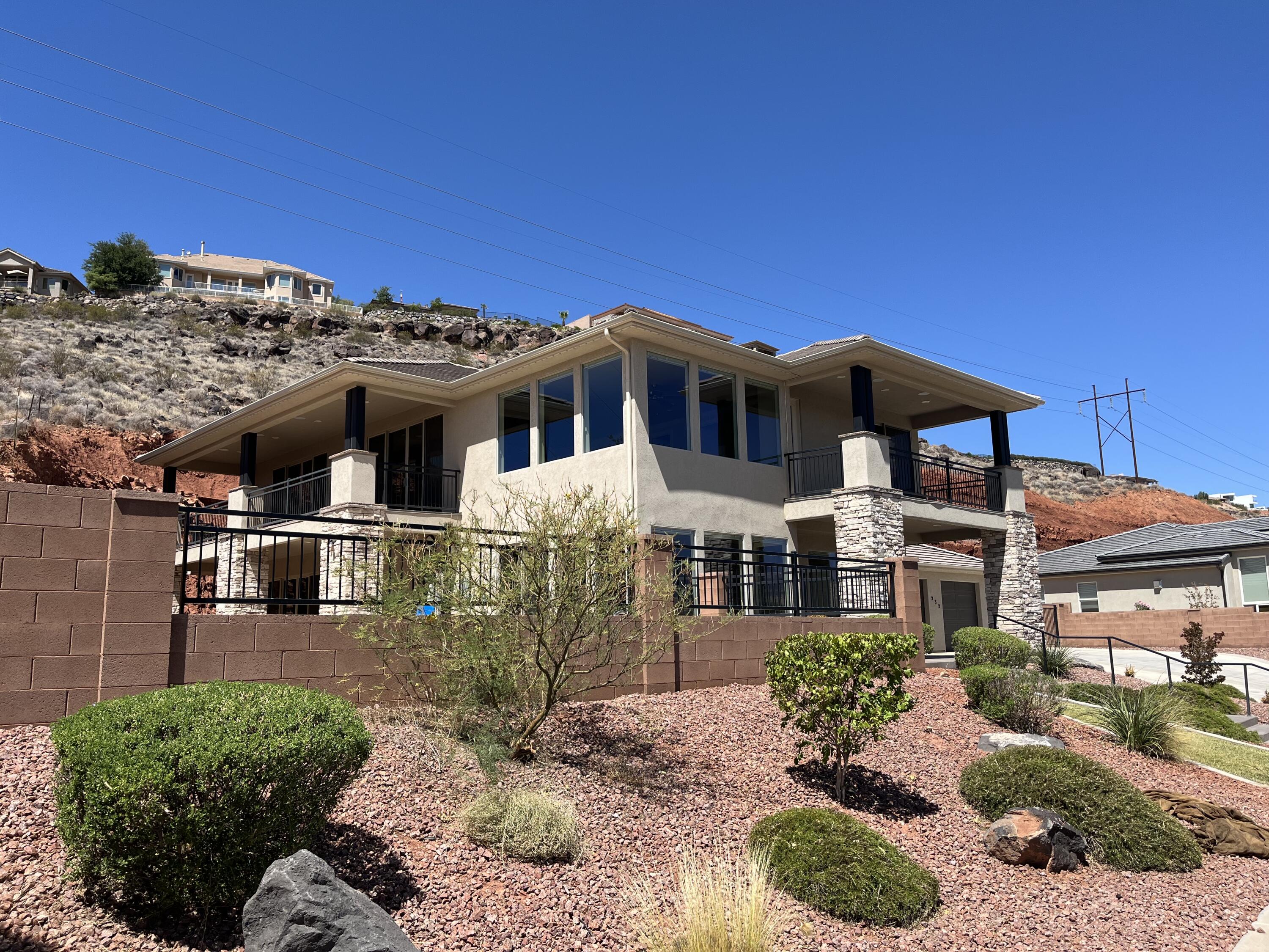 You really want to see this gorgeous masterpiece!
What a fabulous home, centrally located with terrific mountain and city views in a culdesac! Heated pool w/spa on over an acre. New HVAC motor and continued maintenance. Hidden safe room. Fully upgraded and custom built with 5 car garage, plus sixth car converted to climate controlled workshop. Gated, RV parking too. Must See! Come inside today!