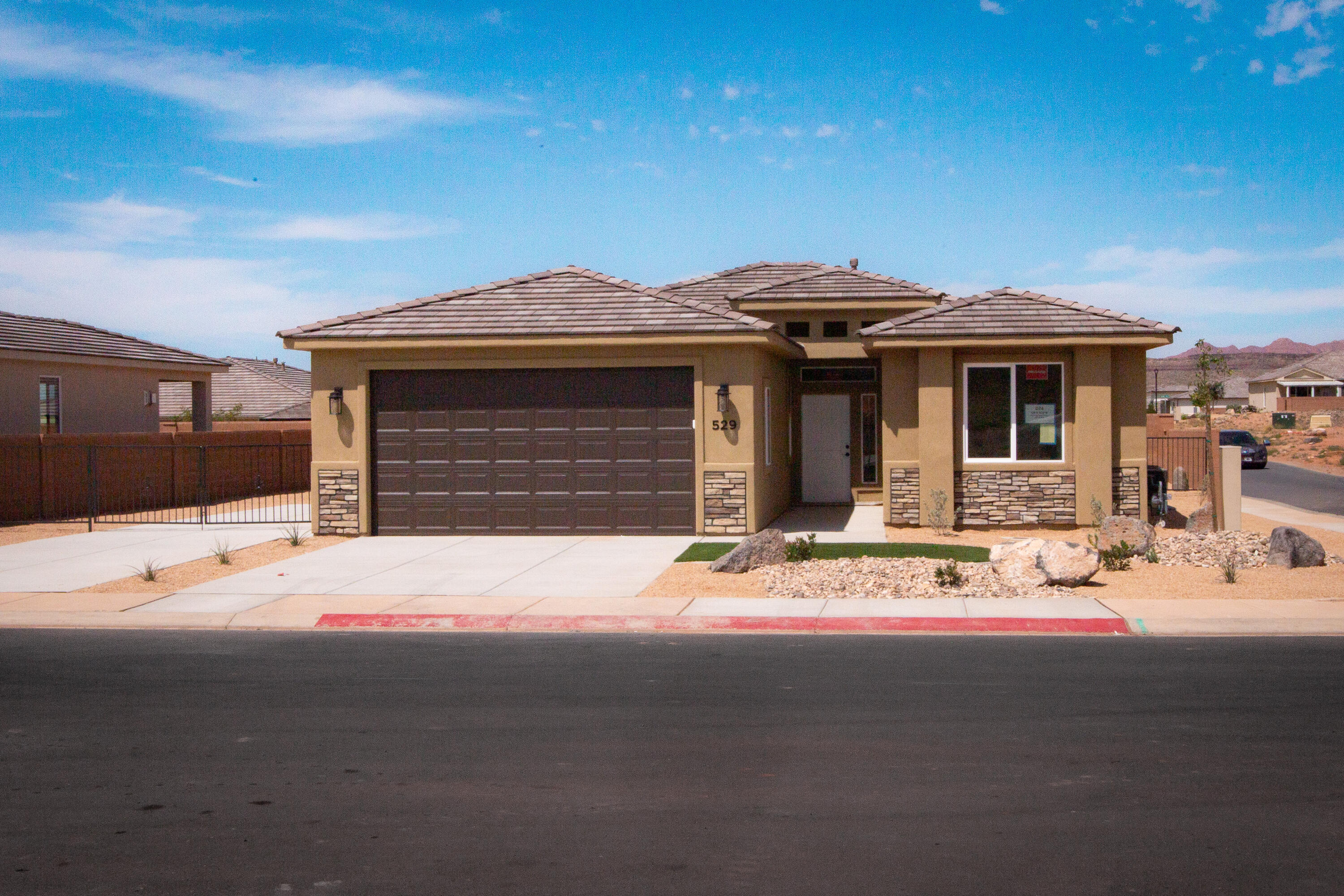 Gemstone Custom Homes - Recently finished and move-in ready! No HOA. Some photos are of a previously built home (same floor plan). This home features drought-tolerant professionally landscaped front and backyard with a covered patio. Master suite includes spacious walk-in closet and fully-tiled recessed walk-in shower with glass door. Two car garage is fully drywalled and painted! Quality GE appliances, stainless sink in the kitchen island, Moen Plumbing fixtures, quartz countertops, spacious pantry, and classic stained hardwood cabinetry with soft-close hinges and under-cabinet lights. Woodgrain tile floors and gas fireplace in living room. Thirty-foot paved RV pad with full-hookups! (water, 30-amp + sewer dump).