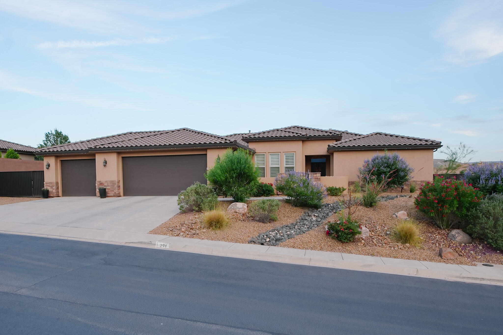 The Southern Utah home you've been searching for has arrived!

Nestled in the desirable community of Mesa Views at Trail Ridge Estates, this beautifully crafted custom home offers the perfect balance of luxury, comfort, and convenience. Enjoy peaceful surroundings while being just 30 minutes from Zion National Park and 25 minutes from downtown St. George.

This stunning home features 4 bedrooms, 3 bathrooms and a thoughtfully designed floor plan. One of the secondary bedrooms includes a private ensuite bathroom, making it ideal for guests or multigenerational living.

The spacious kitchen is equipped with granite countertops, abundant cabinetry, and a walk-in pantry. The oversized primary suite offers direct patio access, fireplace, and a luxurious ensuite bath complete with a separate soaking tub and shower.

Step outside to your own private backyard retreat featuring a sparkling pool, relaxing spa, covered patio, and low-maintenance landscaping. The gated front courtyard welcomes you with beautiful views, while the 3-car garage and side-yard RV parking provide plenty of room for vehicles, toys, and outdoor adventures.

Additional upgrades include plantation shutters throughout, built in shelving, 2 gas fireplaces, Murphy bed in front bedroom/office closet, and quality finishes that make this home truly move-in ready.

Whether you're looking for a full-time residence, a second home, or your own Southern Utah escape, this property delivers the lifestyle you've been dreaming of.