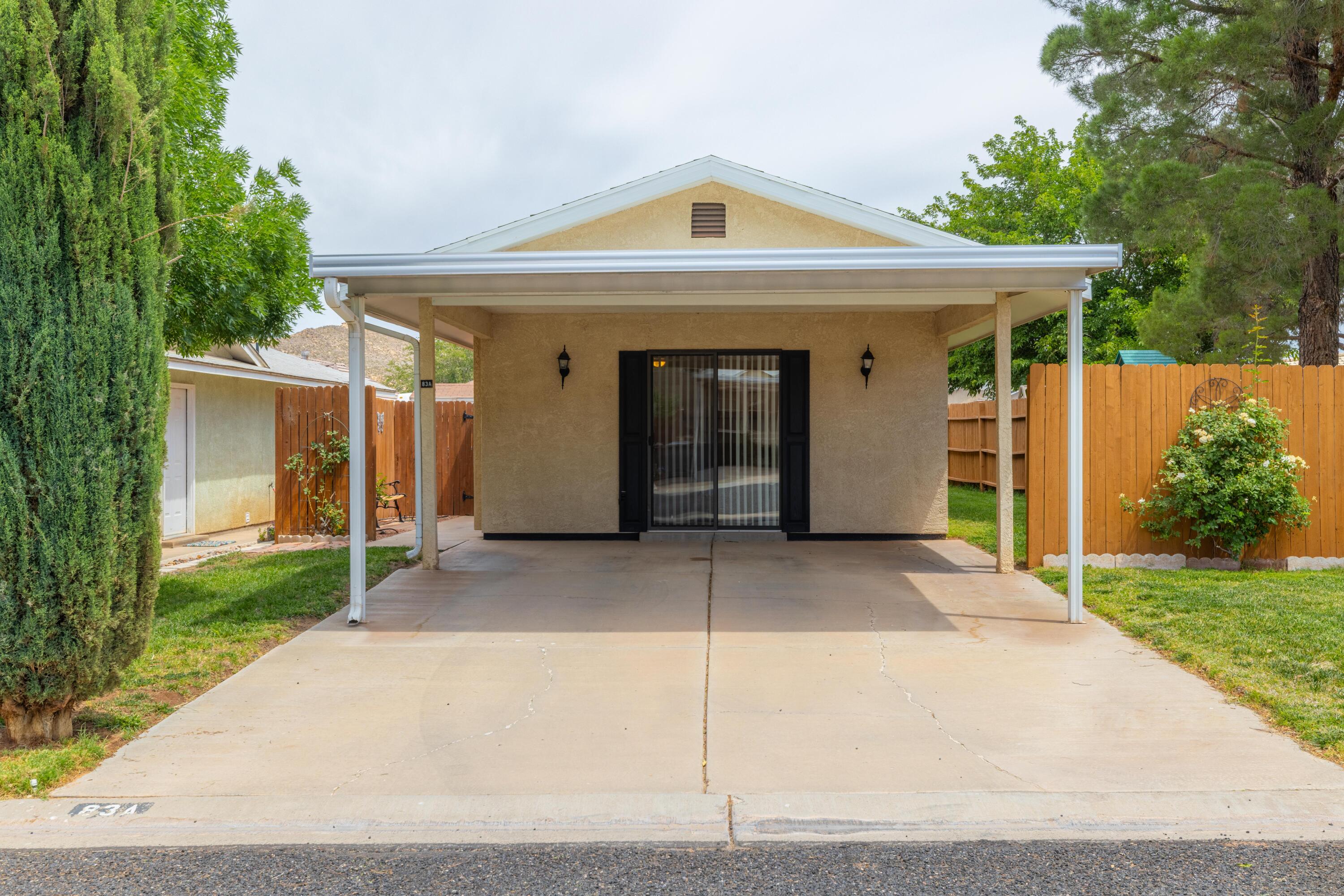 Well-maintained 2 bed, 1 bath stick-built home with a private, fully fenced, low-maintenance backyard. Bright open floor plan filled with natural light. Conveniently located near two reservoirs, shopping, and hospitals, and just minutes from Zion National Park. Located next to a park featuring large mature trees and a play structure. New water heater recently installed. Community clubhouse offers  outdoor pool, exercise room, pavilion, and clubhouse amenities.