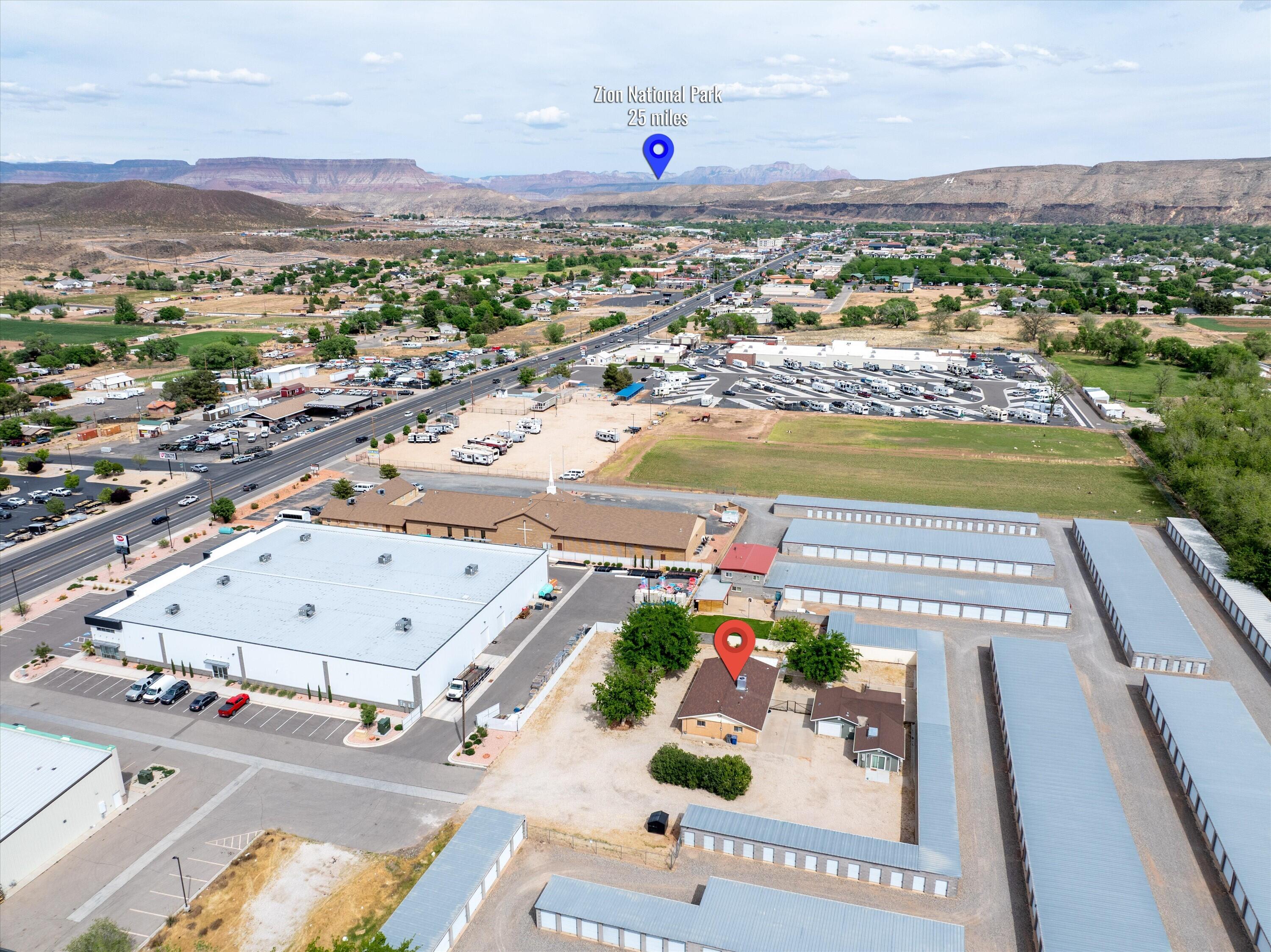 Unique property in the heart of Hurricane offering income-producing potential as a residential or commercial property on 0.58 acres. Highway Commercial zoned with a grandfathered residential overlay. Located just 25 minutes from Zion National Park and only 10 minutes to both Sand Hollow State Park & Quail Creek State Park, this property is ideally positioned for a rental or 2nd home.
Currently configured as a primary residence (Unit A) plus two active short-term rentals (Units B & C), with Units B & C generating $47,500 in short-term rental income in 2025. It's estimated that if Unit A were also rented, the 3 units combined Net Income would be over $80,000 after all expenses including supplies, maintenance, utilities, property taxes, insurance, and cleaning fees. This is one of the only places in Southern Utah where you could live for free while your tenants pay your mortgage, OR own a Vacation Home that is always available to you while also turning a profit. 
The fully fenced parcel offers abundant parking, open space & expansion potential. Separate utility meters and mini-split systems for the rental units enhance operational flexibility. The private setting off State Street provides seclusion while maintaining convenient downtown access. With no HOA, no adjacent residential neighbors, and surrounded by commercial zoning, this property presents a rare opportunity for flexible use & steady income in a high-tourism area.
Highway Commercial zoning supports a wide variety of potential uses including additional rental units, RV park, storage units, or business operations. Opportunities may include adding additional tiny homes or container homes, converting Unit A into a duplex plus the garage into a studio AirBnB, or operating a business alongside residential or rental use. 
A versatile property offering the rare opportunity to live, invest, and grow income in Southern Utah's premier recreation destination.