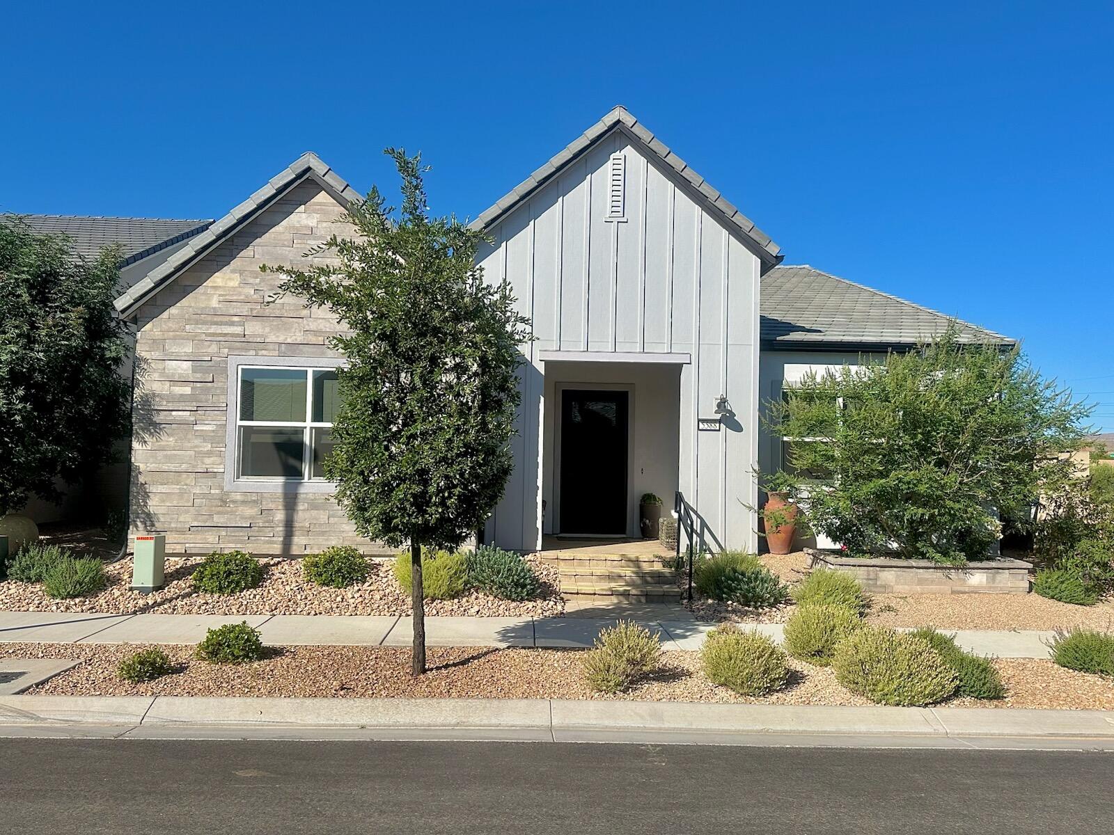 Experience this beautiful Toll Brothers luxury model home located in the highly sought-after Desert Color community. Built in 2024, it is lightly lived in and well cared for. This home offers thoughtfully designed living spaces with approximately $350,000 in premium upgrades throughout. The open-concept floor plan is enhanced by expansive energy-efficient, double-paned windows and a stunning 16-foot sliding glass door that seamlessly connects the back yard, showcasing an impressive water fountain. Designer Restoration Hardware lighting, quartz countertops, and premium KitchenAid stainless steel appliances elevate the home. A dedicated smart home data center discreetly housed within the home serves as the hub for whole-home surround sound, WiFi, and thermostat controls. The fully paid solar system and tankless water heater provides energy efficiency and long-term savings. As part of the vibrant Desert Color community, residents enjoy access to the resort-style lagoon, pools, trails, parks, and other amenities, all included through the HOA, which also provides exterior landscape maintenance and all WiFi and internet costs.