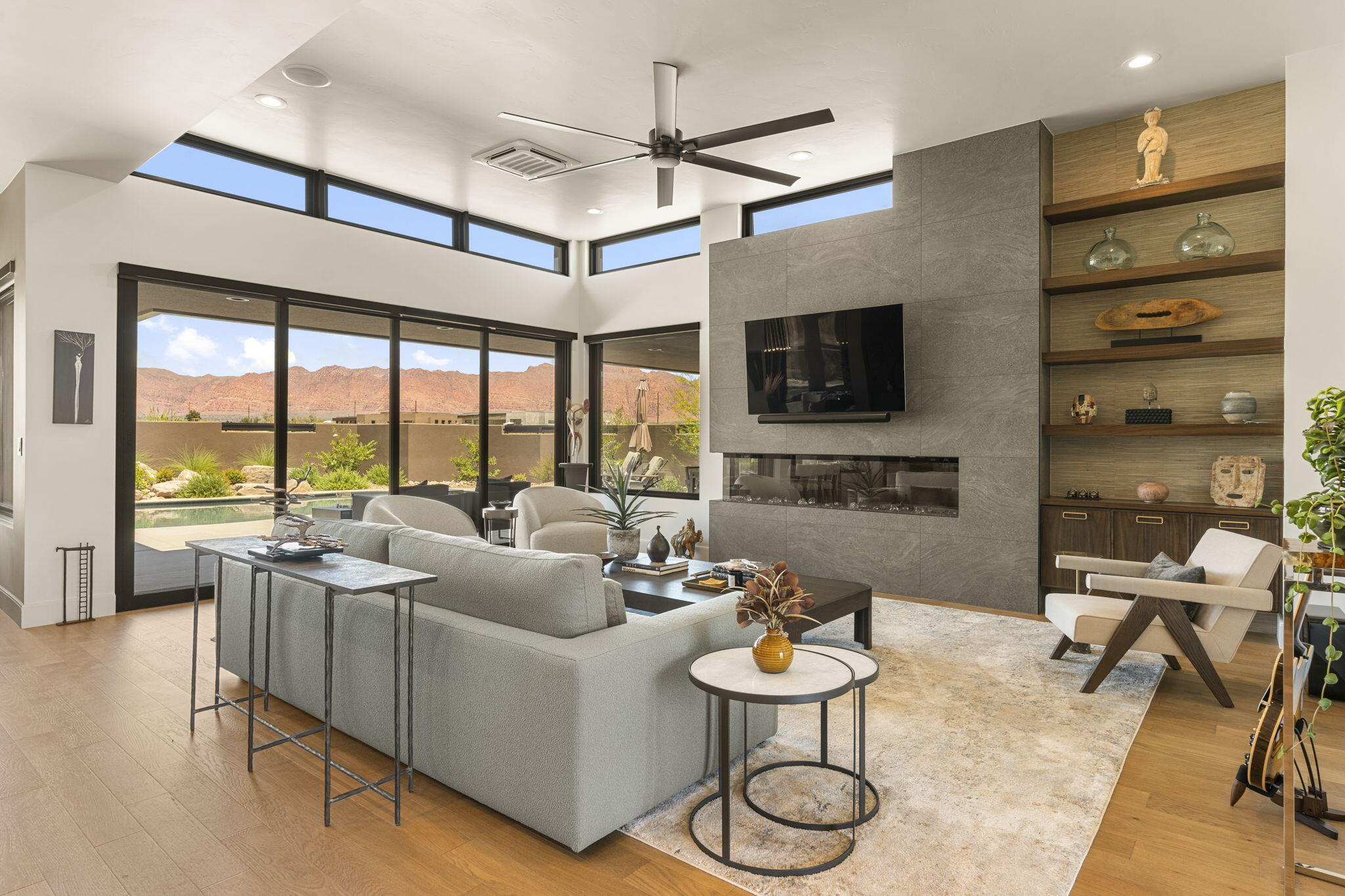 Owner/Agent - This stunning home has PROTECTED VIEWS and is being sold with  with the adjoining View Protection Lot -Parcel  I-SB-52-F for a combined list price of $2,350,000 ($2,100,000 for parcel with the home plus $250,000 for adjoining parcel).  HOME AND VIEW PROTECTION LOT MUST BE PURCHASED TOGETHER. Located in scenic Ivins, this 2025 built luxury home offers a perfect combination of desert modern design with a fully protected and unobstructed extensive valley and red rock mountain views.  The home features an elegant design with a functional layout ideal for entertaining.  The spacious open floor plan with a private casita, a pool and hot tub, custom poolside fire feature, outdoor kitchen and outdoor poolside bathroom in a single level home will wow even the most selective of buyers.  The home features a luxurious owner's suite with fireplace and a one-of-a-kind shower area with architectural features that are truly stunning. Three additional spacious bedrooms, including a private casita with a kitchenette and separate entrance--perfect for guests or multi-generational needs. Hardwood floors throughout and power luxury shades in each room provide the fit and finishes that complete this elegant and modern luxury property.  The 1.03 acre corner lot (.44 Acre Home Parcel plus .59 Acre View Protection Parcel) provides privacy and generous outdoor space with an in-ground pool, hot tub, water feature, fire pit and fire feature. - all oriented to capture the beauty of the surrounding landscape. Furniture could be included, but is negotiable. Square footage figures and lot line Illustration are provided as a courtesy estimate only and were obtained from County Records. Buyer is advised to obtain an independent measurement.