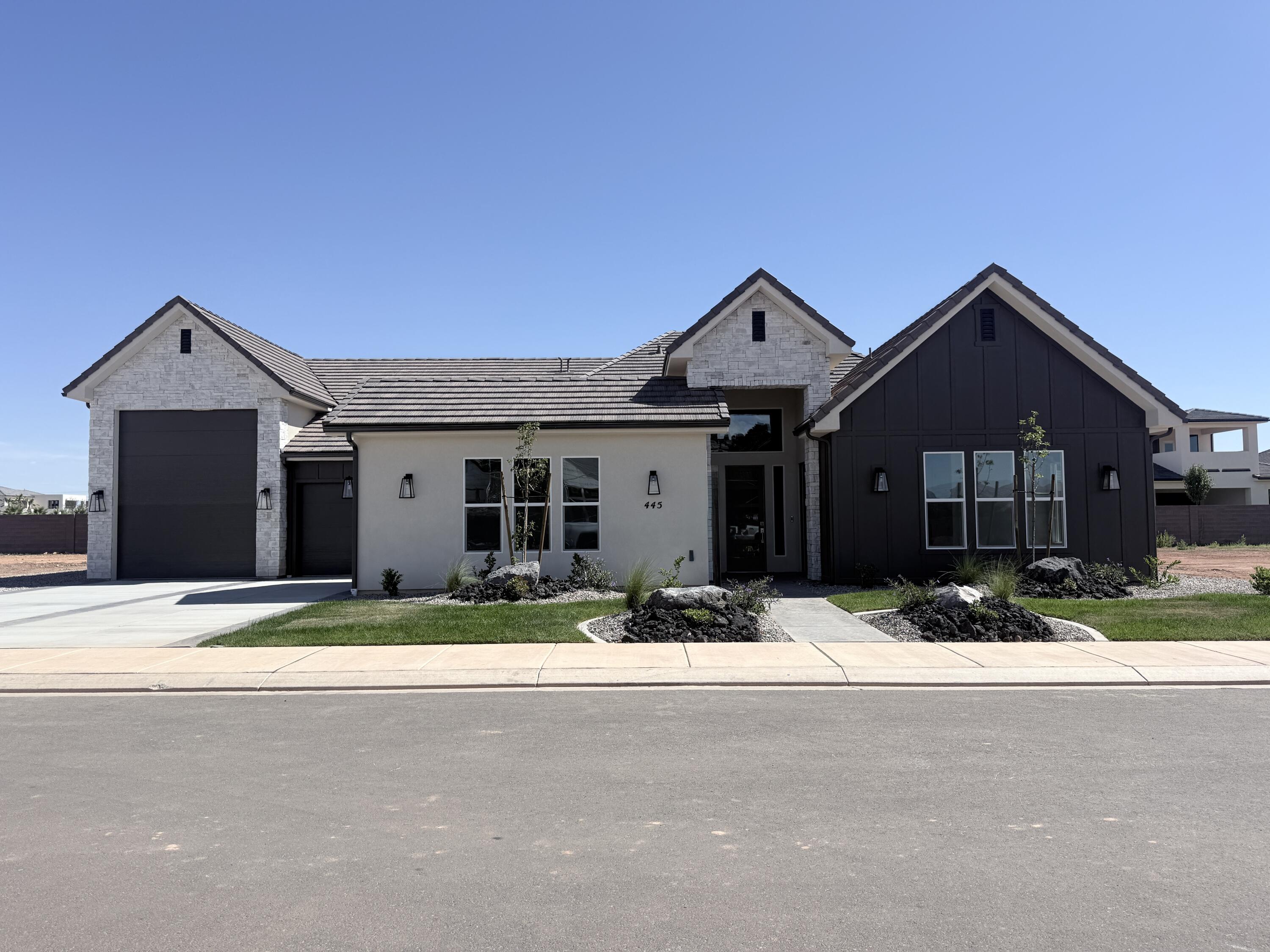 This beautiful home is situated on the east side of town and boasts features such as LVP flooring, quartz countertops, and under-mount sinks with soft-close drawers and cabinets. It  includes a smart home kit, a Wi-Fi router, a programmable thermostat, and a keyless front door lock. The garage features an epoxy-coated floor and accommodates a 41-foot RV garage. Additionally, there is a 15-foot side parking space and a 30-foot backyard. The home is also plumbed for a future pool.