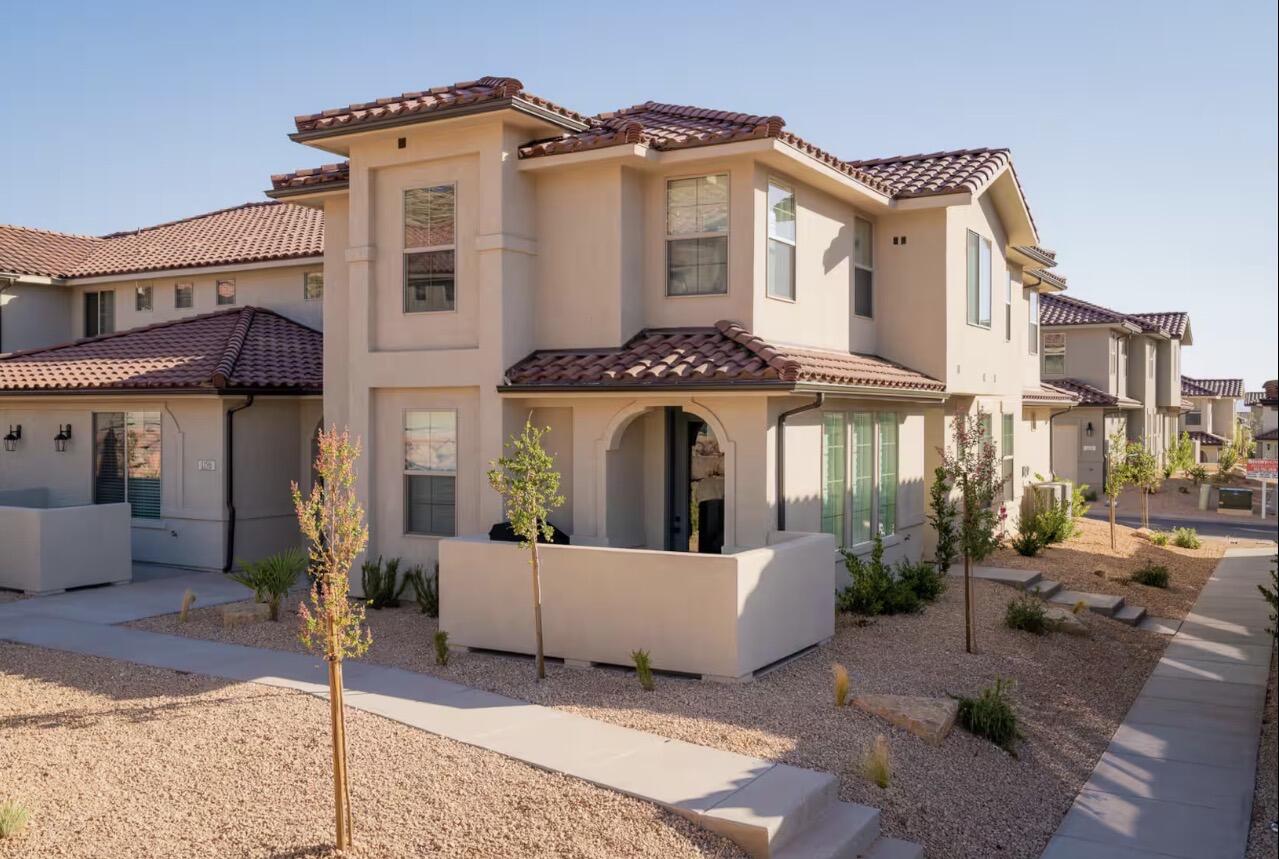 Beautifully maintained, turnkey (furnishings available separately) 4-bedroom, 3.5-bath townhome that comfortably sleeps up to 12 guests in one of Southern Utah's premier nightly rental communities. Whether you're searching for a personal retreat, second home, or investment property, this home offers exceptional flexibility and value.
The thoughtfully designed floor plan features two spacious primary suites with king beds, en suite baths, tiled walk-in showers, and walk-in closets, including one suite with a separate bunk alcove. Two additional bedrooms offer a queen bed and a twin-over-full bunk with trundle, providing plenty of space for family and guests.
The main level is ideal for gathering, featuring a large kitchen with island, corner walk-in pantry, spacious dining area, family room, dedicated laundry room, abundant storage, stylish black hardware and plumbing fixtures, and a finished garage with an epoxy floor.
Windows feature custom plantation shutters. Custom lighting added in kitchen, and the great room and two primary bedrooms feature ceiling fans. Locking owner's closet, large enough to keep cleaning supplies and valuables.
Located in a vacation rental-approved community, the property has a proven history as a successful Airbnb with a 4.92-star average rating from 104 reviews, while also being enjoyed and meticulously maintained as the owners' second home.

Community amenities include a resort-style pool with lazy river, hydrotube, two hot tubs, pickleball courts, and beautifully landscaped common areas.

Just minutes from Sand Hollow Reservoir, Quail Creek State Park, Snow Canyon, championship golf, Tuacahn Center for the Arts, downtown St. George, and Zion National Park, this home offers year-round recreation and an unbeatable Southern Utah lifestyle.