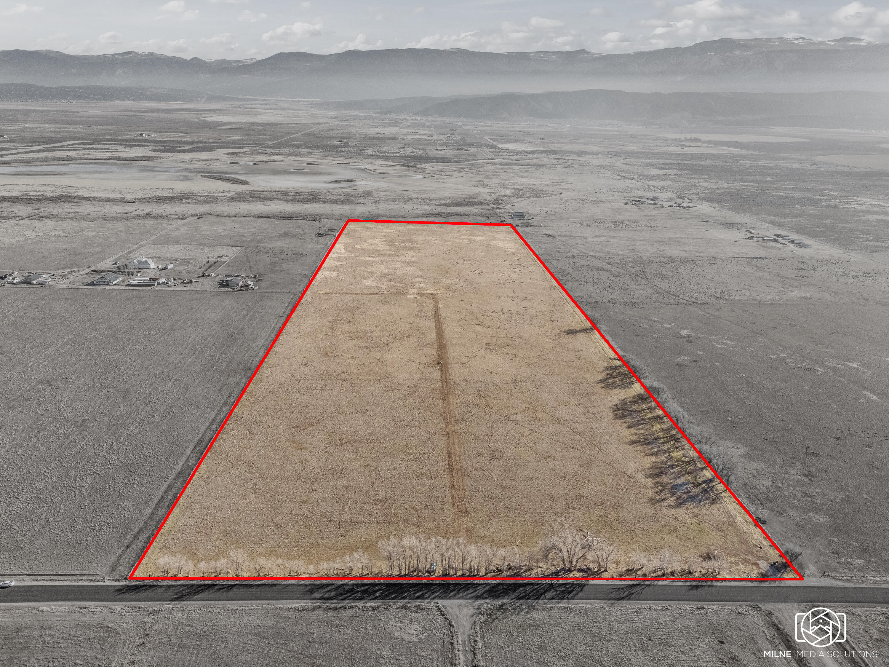Build Ready 50-acre parcel with water and power for 2 or more homes.

Key features
- 50 acres of flat, build-ready land with limitless potential for a private estate, a boutique community, or a high-value subdivision of multiple homes
- Dramatic panoramic views that stretch to the horizon
- Seller-has 3 home plans available for purchase to jumpstart your development
- Water security with a powerful 5 hp culinary well and 1929 water rights granting access to 6 acre-feet of water
- Electricity available on-site, simplifying the development process
- Ample space for recreational facilities, expansive gardens, guest accommodations, and more

Development potential
- A rare opportunity in a booming area poised for future growth
- Flexible use: private estate, charming cluster of homes, or an attractive investment
- Ready-to-execute framework with existing water rights and utilities to accelerate your plans

This isn't just land--it's a gateway to a lifestyle and a smart investment in a flourishing community. Whether you're envisioning a private retreat, a thoughtfully designed neighborhood, or a strategic hold for the future, this prime parcel is ready to bring your vision to life.
