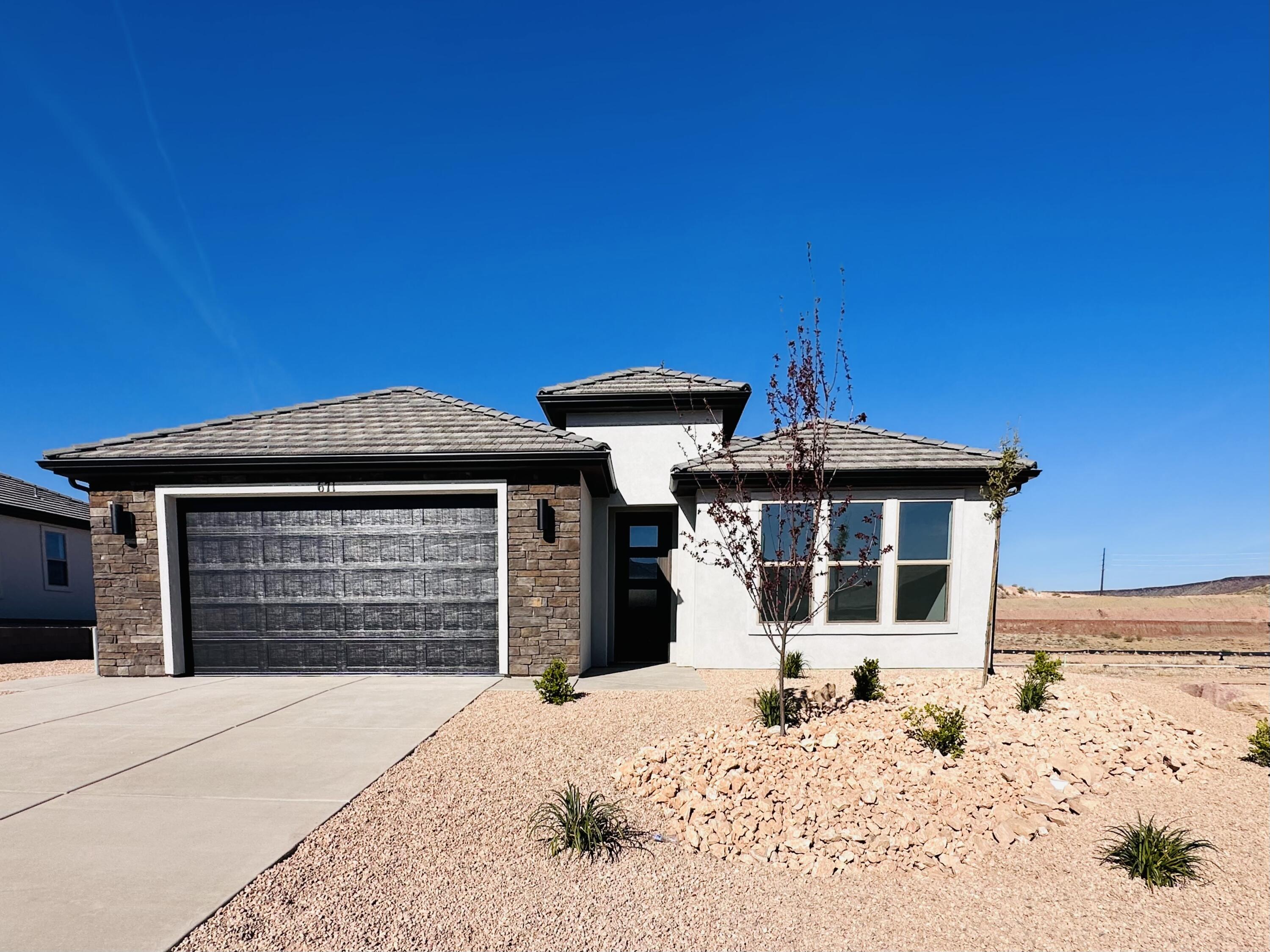 Discover exceptional craftsmanship and timeless design in this beautifully appointed 3-bedroom, 2-bath residence located in the highly desirable Divario community, with over $52 K in design upgrades. Thoughtfully constructed with 2x6 exterior wall framing, this quality-built home offers both enduring value and elevated comfort.
Inside, you'll find upscale finishes throughout, including 42'' upper cabinetry, elegant quartz countertops, 8' interior doors, and a spa-inspired primary bath featuring a stunning tiled shower with zero-step entry. Level 3 LVP is found throughout high traffic areas, while bathrooms and laundry room have elegant tile. Upper cabinets are found in the laundry room for all your storage needs. The oversized, fully finished 2-car garage provides generous space for vehicles, storage, and lifestyle needs. The large side yard-perfect for RV parking-and fully landscaped backyard make this home completely move-in-ready!
Situated in a premier location surrounded by scenic red rock beauty, residents enjoy access to a private community pool and bathhouse--unique to Rosalia Ridge, along with nearby trails and parks that enhance the Southern Utah.