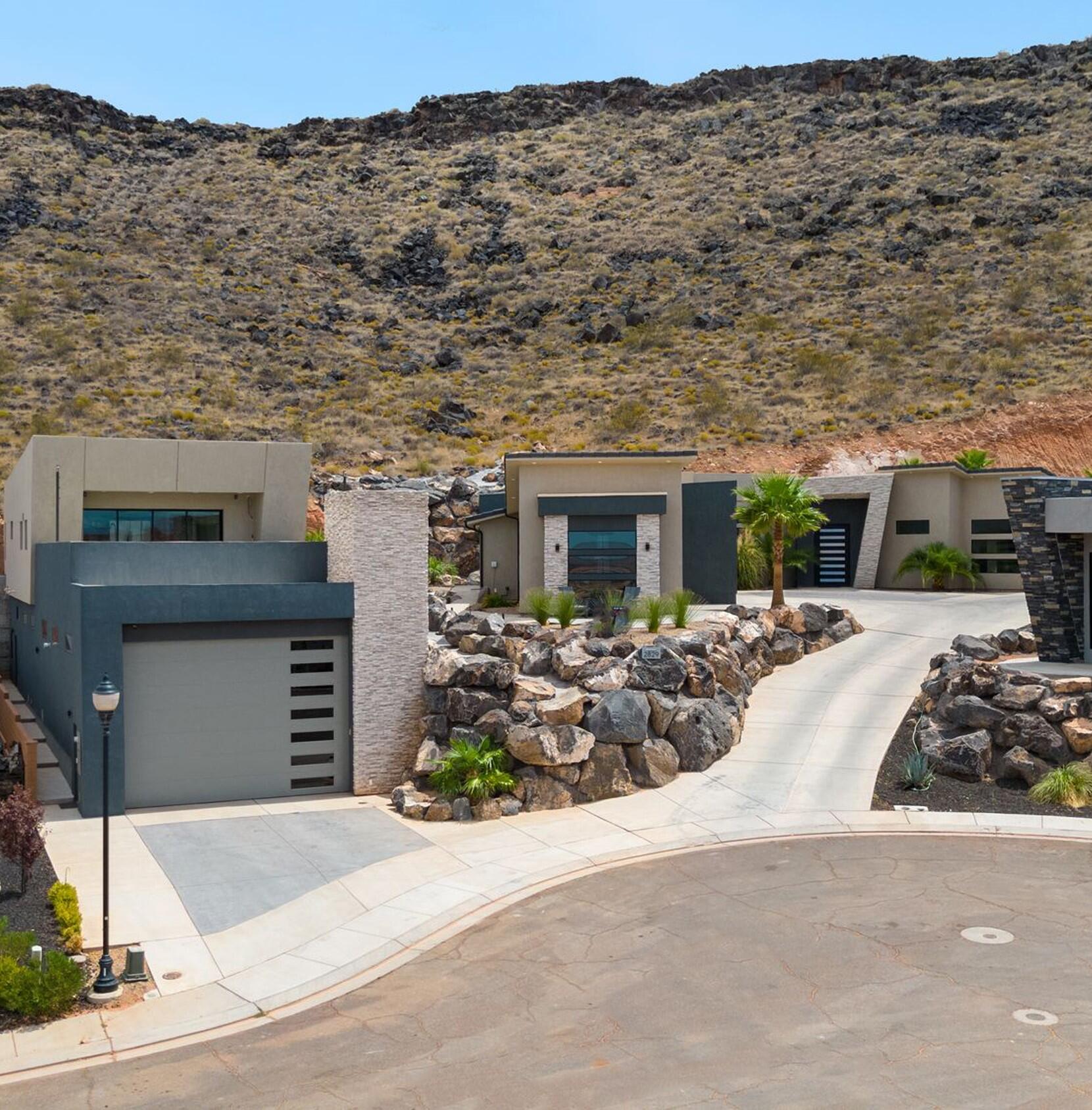 A luxurious custom home that truly stands out with its unique design and features. including Mother-in-law apartment or Man cave whichever suits your needs. Double RV garage with sewer dump, hot/cold water hookup and multiple 220 plugs. The RV garage is heated and cooled. The main house is perfect for entertaining with the design concept of the outdoors coming in. The huge sliding glass door truly makes the backyard an extension of the living space. There are 3 separate suites in the main house that are completely private with there own exterior entrances. The Pool house has a full bathroom, bedroom and outside shower. This is the builders personal home with all the extras. OWNER AGENT!!!!