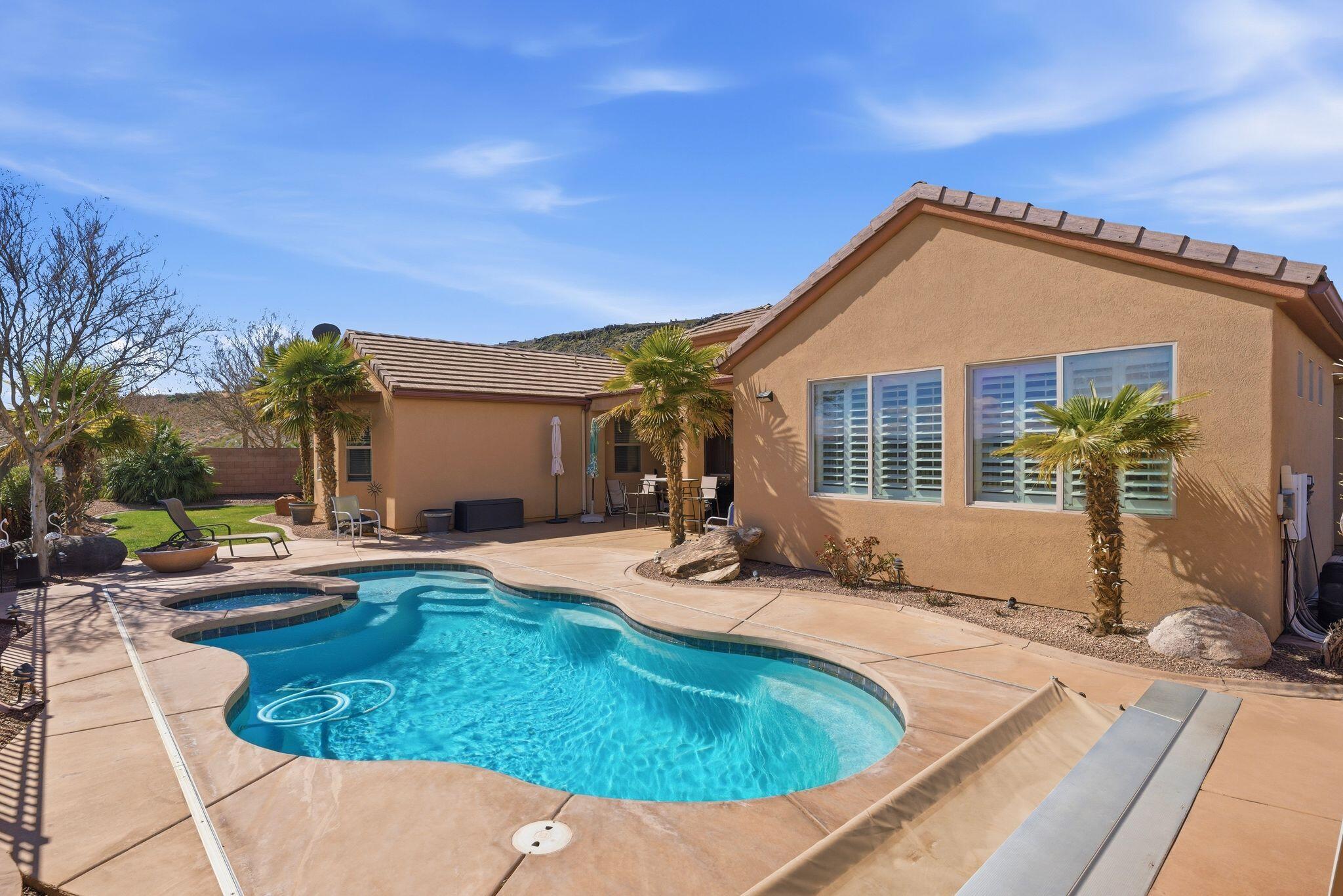 Beautiful Coral Canyon home offering space, comfort, and incredible Southern Utah views. All situated on a quarter-acre lot designed for both everyday living and entertaining.

The backyard is a standout feature, complete with a built-in pool and hot tub and sweeping views of Pine Valley Mountain, Zion National Park, and Coral Canyon golf course. Whether you're relaxing poolside, hosting friends, or enjoying a quiet evening outdoors, the setting provides a perfect blend of privacy and scenery.

Inside, the home offers a functional layout with spacious living areas and comfortable bedrooms, providing flexibility for families, guests, or a home office. Large windows bring in natural light and frame the surrounding landscape.

Located in the desirable Coral Canyon neighborhood close to the golf course, outdoor recreation, parks, and convenient access to St. George amenities, this property offers the best of Southern Utah living with room to relax, gather, and enjoy the views.