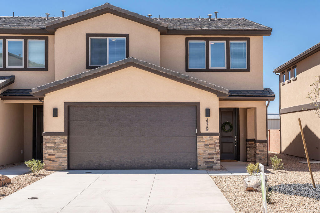 Brand new and beautifully designed townhome offering modern comfort and style. This home features quartz countertops, tile flooring, and upgraded carpet, along with custom cabinetry and stainless steel appliances. The spacious primary suite boasts a huge master bathroom and walk-in closet, plus tile tub and shower surrounds for a clean, upscale finish. Enjoy a private backyard, perfect for relaxing or entertaining. Ideally located close to schools, as well as hiking and biking trails, Sand Hollow Reservoir and sand dunes, and just 30 minutes from Zion National Park. Low-maintenance living with unbeatable access to Southern Utah recreation.