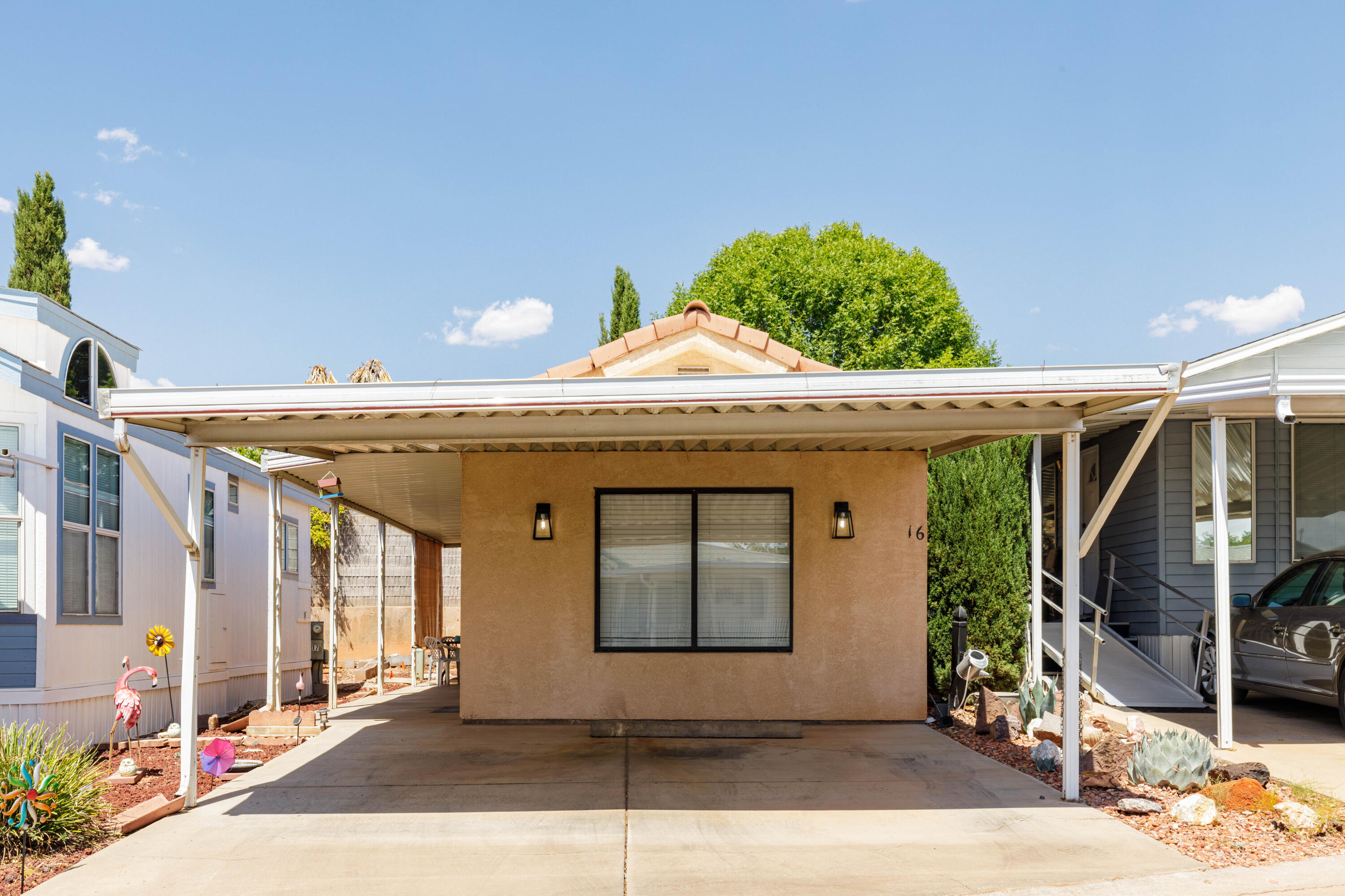 THE BEST THINGS COME IN SMALL PACKAGES! This well- stick built (not a mobile) home is ideal as a relaxed retirement retreat or a second home, within a welcoming 55+ community. Traditional financing options available. Affordably priced Move-in ready! It features brand-new appliances, including a refrigerator, oven, and dishwasher so you can start enjoying life from day one.
A smart, well-planned layout maximizes every inch of living space, creating easy, comfortable rooms that invite you to unwind. Step outside to expansive covered porch areas where you can soak up the famous St. George sun in complete privacy. Practical touches abound, including attached 2-car covered parking and a brand-new storage shed in the backyard to keep essentials neatly organized. As part of a vibrant community, you'll enjoy a friendly atmosphere that makes socializing easy and everyday living effortless.  Enjoy socializing at the pool, Hot Tub and community events.  Don't miss this incredible opportunity to own a quality, low-maintenance home in a sought-after setting. Schedule a tour today and see why this could be your perfect getaway.