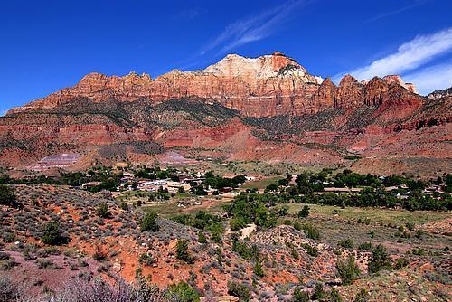 Shares Zion Park Boundaries. This property has an insurable easement that is up to Town of Springdales ordinance & zoning regulation width and standard--It connects to adjacent property. This parcel is best sold with adjacent parcels: S-94-E, S-94-C, S-126-B, and S-126-D, S-126-C, S-126-E. *The adjacent properties referenced above are separate purchases not included in the above listed price. All views are unobstructed. North view looks up into Zion Canyon. Watchman Canyon Cliffs are directly east. West Temple Mt. is majestically West.