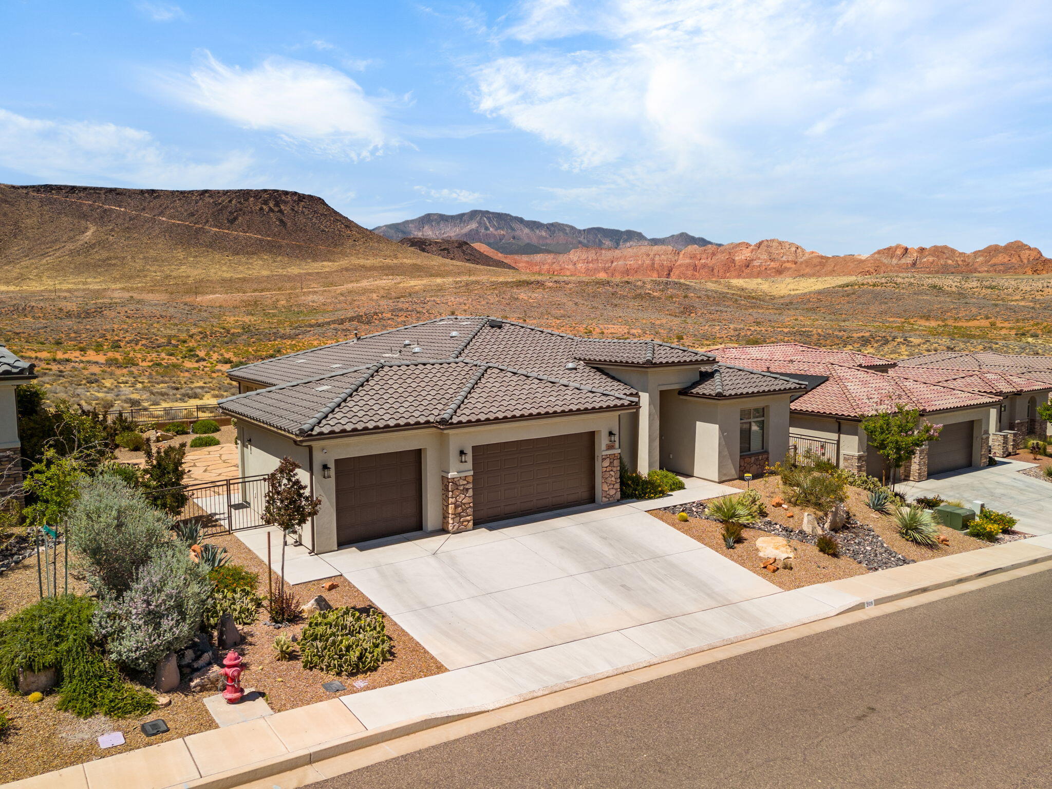 Enjoy breathtaking unobstructed red rock, valley, and mountain views from this beautifully maintained one-owner home. Perfectly positioned to capture the surrounding desert landscape, the property offers exceptional privacy with no homes directly behind and panoramic vistas that can be enjoyed from both inside the home and the full-length covered patio.

Enjoy breathtaking unobstructed valley, red rock, and mountain views from this beautifully maintained one-owner home. Thoughtfully designed with a desirable split-bedroom floor plan, the home offers quality upgrades, abundant natural light, and exceptional indoor-outdoor living.

The open great room is anchored by a corner fireplace and inviting gathering space. Multiple Solatube skylights throughout the home provide abundant natural light, while 8-foot doors enhance the spacious feel. The upgraded kitchen features granite countertops, a built-in oven and microwave, subway tile backsplash, and a walk-in pantry. The private primary suite offers a large walk-in closet and an upgraded shower with dual shower heads and custom glass enclosure. 

Step outside to a full-length covered patio with electric shades and a large custom sandstone patio, where sweeping unobstructed desert, red rock, valley, and mountain views create a rare sense of privacy and serenity. With no homes directly behind, this exceptional outdoor space is perfect for relaxing, entertaining, and enjoying the natural beauty Southern Utah is known for.

Additional features include select electric window coverings, a spacious laundry room with built-in hanging rod and backyard window, and a versatile front bedroom with double doors ideal for an office, den, or hobby room.

Pride of ownership is evident throughout this exceptional home, where comfort, quality, privacy, and unforgettable views come together.***