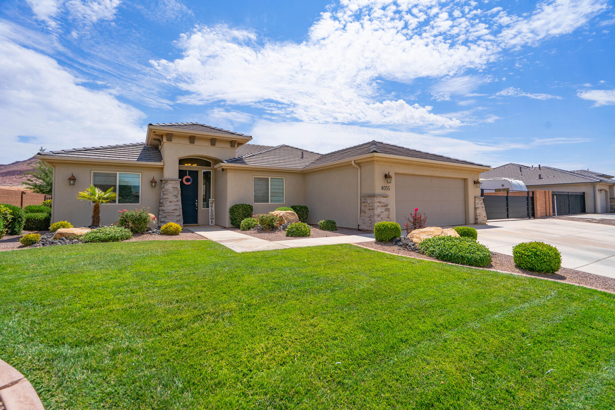 Privacy, views, and modern comfort come together at this stunning 2019-built home on a quiet street in one of Washington's most peaceful neighborhoods. With four bedrooms and two bathrooms across 1,831 square feet of single-level living, this property offers room to grow and space to breathe.

Inside, brand-new flooring in the living room gives the main area a fresh, contemporary feel. The open floor plan flows naturally from kitchen to dining to living spaces, making everyday life effortless and entertaining a joy.

The backyard is the true highlight. Bordering BLM land, you have no rear neighbors--just uninterrupted views of the red rock country that makes Southern Utah famous. A beautifully crafted rock wall adds character to the outdoor space, perfectly complementing the stunning Warner Valley views. Whether grilling with friends, watching sunsets paint the cliffs in amber and rose, or enjoying morning coffee in total tranquility, this backyard delivers an everyday escape.

For adventurers, spacious RV parking provides room for trailers, boats, or off-road toys, making it easy to hit the trails at Sand Hollow or explore the region's endless recreation. Yet you're just minutes from shopping, dining, schools, and all the conveniences of St. George. Families will also appreciate being within Crimson school boundaries, offering access to highly regarded schools just a short drive away.