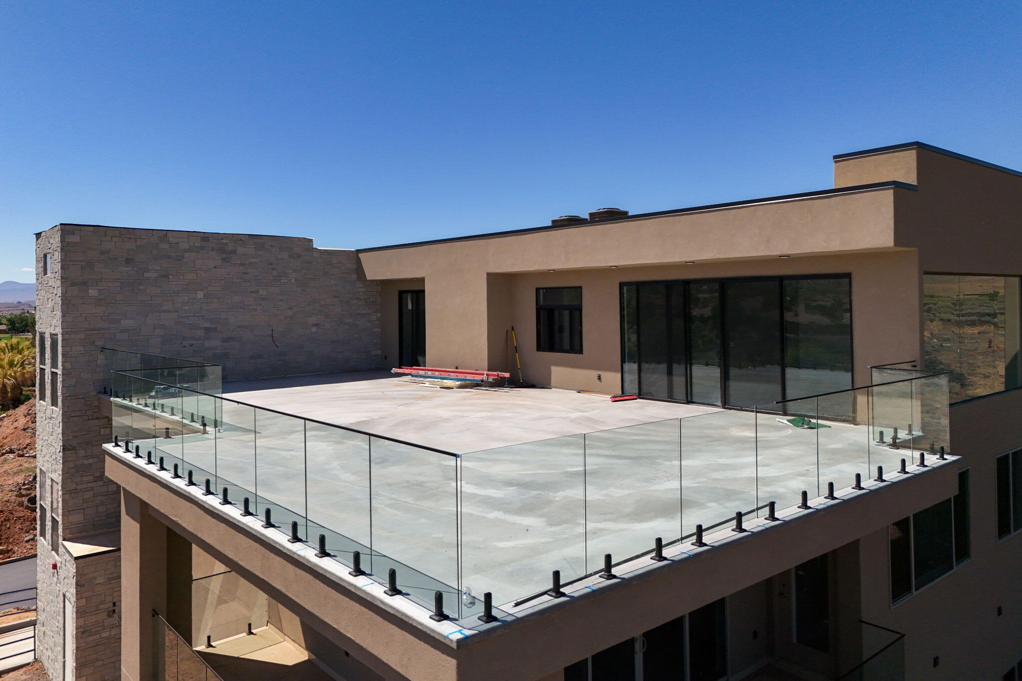 Some condos offer a view. This one offers a perspective. Positioned directly on the Sunbrook Golf Course, this brand new flagship unit represents the absolute pinnacle of luxury condo living in Saint George -- a city that has quietly become one of the most coveted destinations in the American Southwest. With unobstructed, panoramic views of Snow Canyon State Park and the Pine Valley Mountains stretching endlessly before you, this is not simply a place to stay. It is a permanent front-row seat to one of nature's greatest shows.

Step inside and the level of craftsmanship is immediately unmistakable. The expanded floor plan flows with an ease and generosity rarely found in condo living -- every surface, every fixture, every detail selected with intention. The gourmet kitchen is a chef's dream: premium appliances, designer cabinetry, and the kind of counter space that makes entertaining feel effortless. Three full bathrooms ensure every guest experiences the same luxury standard, while the primary suite is a sanctuary unto itself -- a spa-inspired bath that transforms your morning routine into a ritual.

'Step out onto your massive private patio, pour a drink, and watch the sun set fire to Snow Canyon's red rock cliffs. There is no finer seat in Saint George -- and it's yours every night.'
But the true showpiece of this unit is the massive private patio. Overlooking the Sunbrook fairways with Snow Canyon and Pine Valley as your uninterrupted backdrop, this outdoor living space is an entertainer's paradise -- complete with an outdoor kitchen that makes al fresco dining the only sensible choice every evening. Whether you're hosting a sunset gathering or sitting in quiet solitude with your morning coffee as the canyon glows at dawn, this patio will become the heart of your life here.