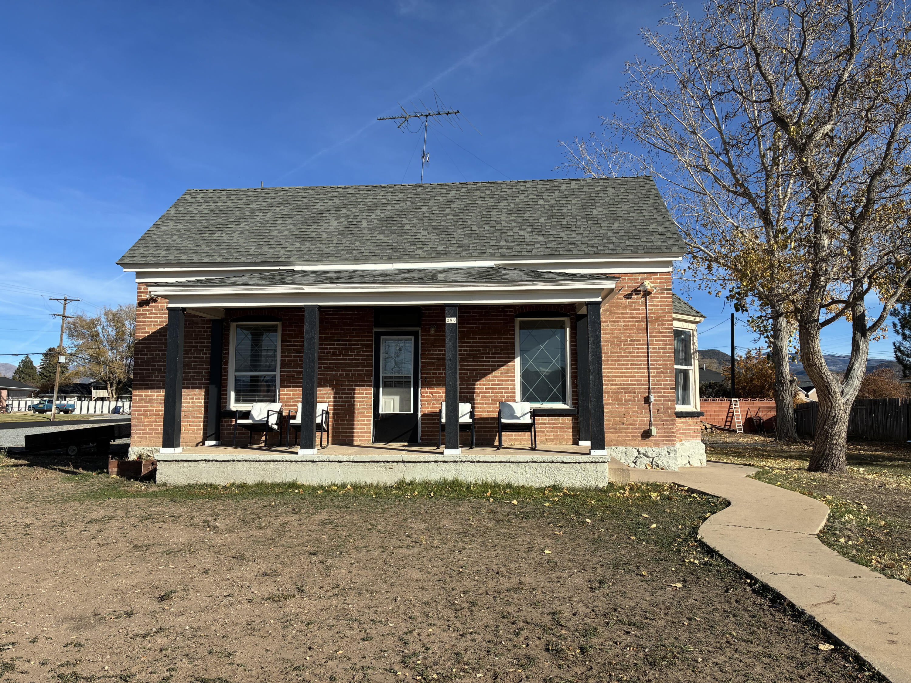 Step into the charm of small-town living with this beautifully renovated 1901 historic home. Featuring a classic brick façade, inviting front porch, and thoughtful updates throughout, this cozy residence offers the perfect mix of old-world character and modern comfort. Most furnishings are included, allowing you to move right in and enjoy the space from day one. The 0.24-acre lot provides room to relax, garden, or entertain, while the 300 sq. ft. cellar. with indoor access, adds convenient storage or hobby space. Whether you're sipping coffee on the porch or enjoying the home's warm interior, you'll appreciate the craftsmanship and welcoming atmosphere that make this property truly special.