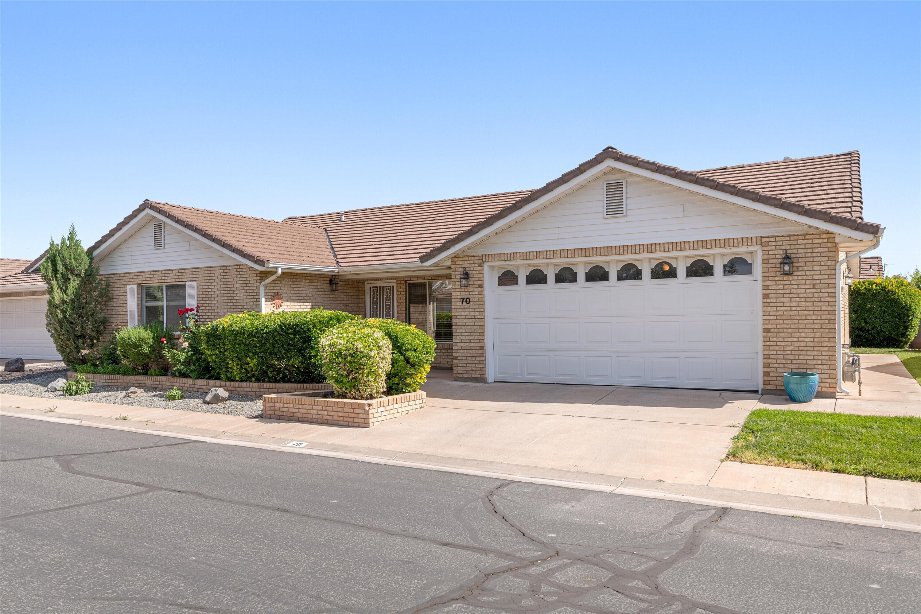 Charming 3 bedroom 2.5 bath home all on one level in an adult community.  Perfect for a second home get away or full time home.  This home has lots of storage space including walk in closets and that extra half bath in the garage.  Granite countertops and ceiling fans.  Covered patio area to enjoy this peaceful setting.  The community offers a clubhouse, fitness center, indoor pool and hot tub.   Close to shopping, the post office, Dixie regional medical center and walking paths.