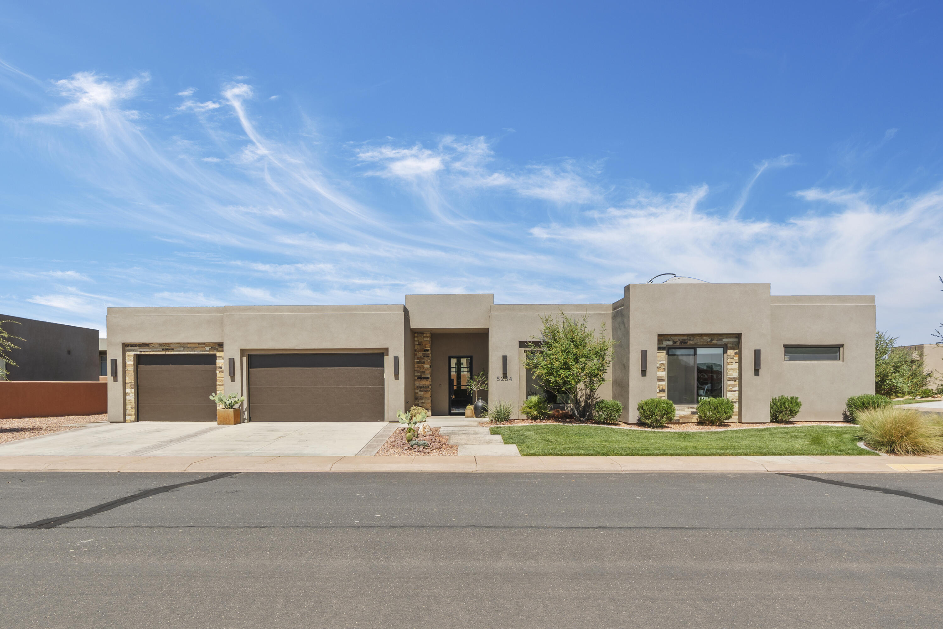 Sand Hollow Escape with Rooftop Views minutes from Zion Discover this spacious 4-bedroom, 4-bathroom home, perfectly situated in the desirable Sand Hollow Resort community in Hurricane, Utah. Each bedroom includes its own en suite bath and walk-in closet, offering privacy and comfort for all. Designed with care by a professional interior designer, this home is filled with upgrades throughout: brand-new carpet, elegant tile flooring, custom beams in the living room, upgraded lighting, ceiling fans in every bedroom, and high-end appliances. The striking wrought iron and glass front door creates a warm welcome into this thoughtfully curated home. Enjoy breathtaking views from the rooftop patio-perfect for stargazing and evening gatherings.