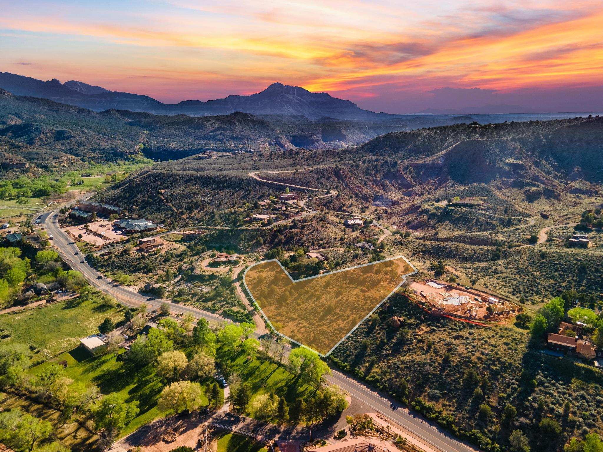 A Rare 2.1-Acre Legacy Homesite Overlooking Zion

Exceptional properties are becoming increasingly difficult to find in Springdale, and opportunities like this are truly limited. Just minutes from Zion National Park, this remarkable 2.1-acre homesite offers an extraordinary combination of privacy, space, accessibility, and some of the most breathtaking views in Southern Utah.

Situated on an elevated setting with commanding 360-degree panoramas, this property captures sweeping vistas of Zion Canyon, the Virgin River Valley, and Parunaweep Canyon. From sunrise illuminating the towering sandstone cliffs to spectacular sunsets painting the landscape in vibrant colors, every day feels like a masterpiece unfolding before your eyes.

Unlike many properties near Zion, this parcel provides the space and flexibility to create a truly custom retreat. Whether you envision a contemporary luxury residence, a mountain-modern getaway, or a timeless family estate, the setting offers a rare canvas for building a home that reflects your vision while embracing the surrounding natural beauty.

The location strikes an ideal balance between seclusion and convenience. Tucked away on a private road, you'll enjoy peace, quiet, and dark night skies, yet remain just moments from the Zion Canyon Shuttle, local dining, shopping, and endless outdoor recreation. Hiking, biking, photography, wildlife viewing, and year-round adventure begin right outside your door.

With utilities available along Kinesava Drive, much of the groundwork is already in place to help bring your dream home to life. Few remaining homesites offer this combination of acreage, accessibility, privacy, and iconic views in one of the most sought-after destinations in the Southwest.

This is more than a homesite--it is an opportunity to own a piece of one of America's most celebrated landscapes and create a legacy property to be enjoyed for generations.

Build where every day begins and ends with a view worth remembering.