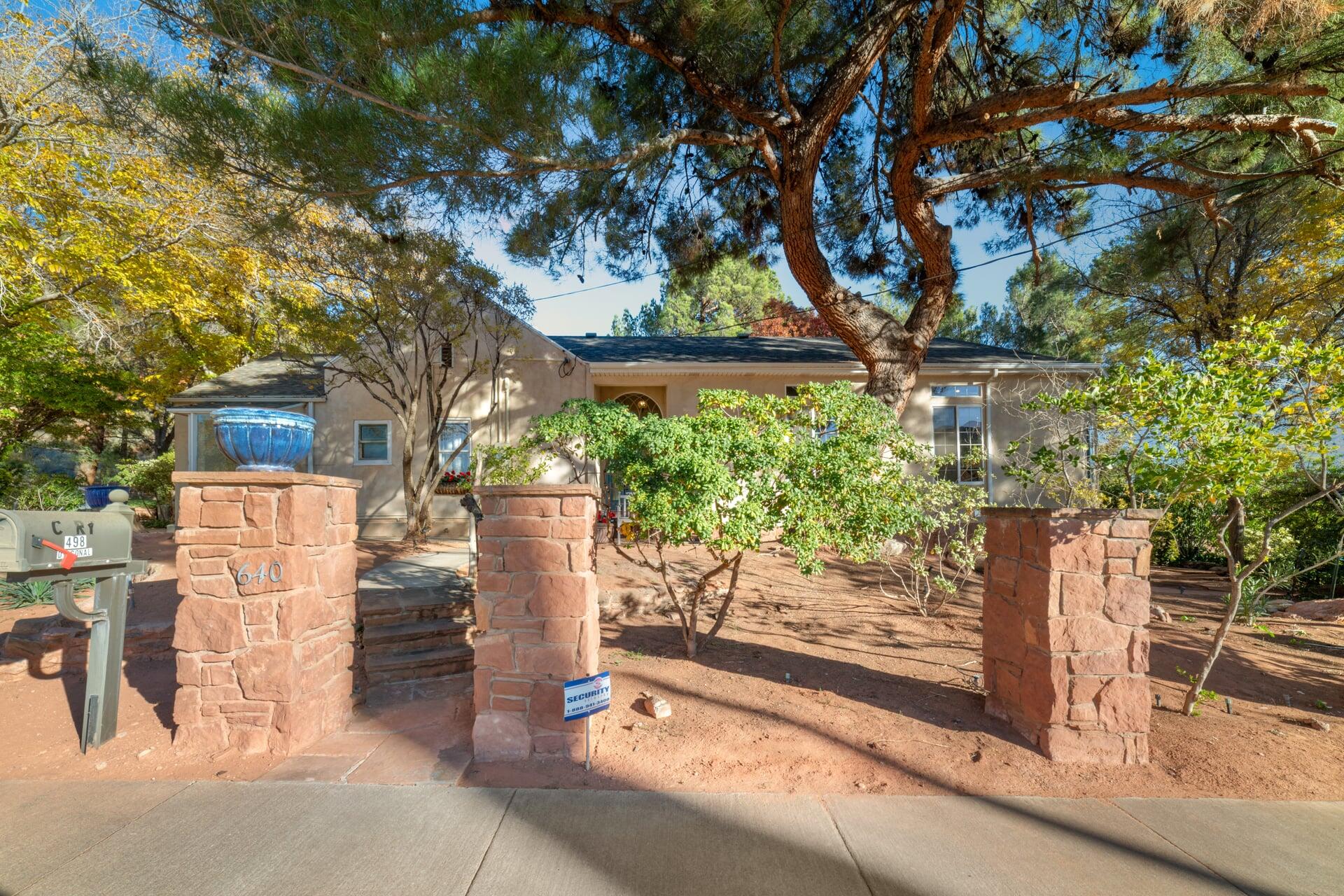 Calling All Visionaries!  PRICE REDUCED over $200,000!!!  BRING ALL OFFERS!  Rare opportunity to own a distinctive downtown Pioneer home nestled on a generous wooded 1.1-acre lot. This property beautifully marries historical charm, with origins dating back to 1919, and modern enhancements from a thoughtful 1997 addition.  This property offers a blank canvas for restoration or immediate occupancy. The expansive garden serves as a tranquil oasis, featuring mature trees and shrubs, complemented by three stunning patios, and a Rock adorned Fountain that invite relaxation amidst nature.  NOTE:  Property north of house goes back to where the adjacent townhomes ends.  This section is in the City Hillside Ordinance and Rockslide Zone.  No building allowed here. City may allow a sports court or Pickle Ball Court etc.