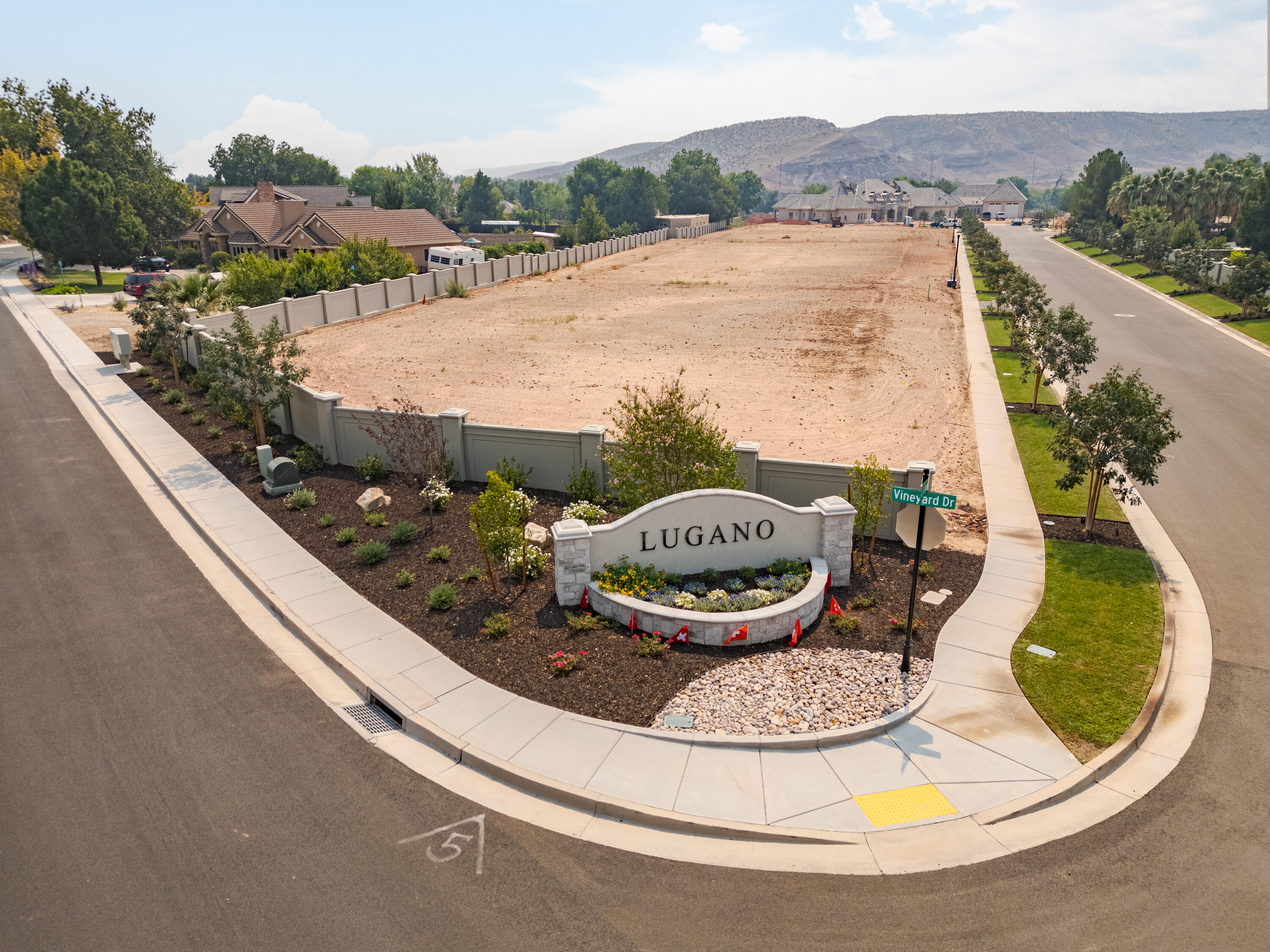 Nestled within the brand-new Lugano subdivision in historic Santa Clara, this remarkable .61-acre lot offers an unparalleled opportunity to craft your ideal living space. With 217 feet of frontage, this expansive parcel provides the perfect canvas for your vision of your future home. The commitment to excellence extends to the smallest of details. Monument signs adorning both entrances, extra wide park strip with individually lit 15-year-old trees planted, high-end cement fencing, and landscaped common areas. Other details include electric outlets at the base of each tree and upgraded signage throughout the subdivision, to further elevate the overall aesthetic. With boundless potential, this lot invites you to turn your dream home into reality. Schedule a viewing and call for questions!