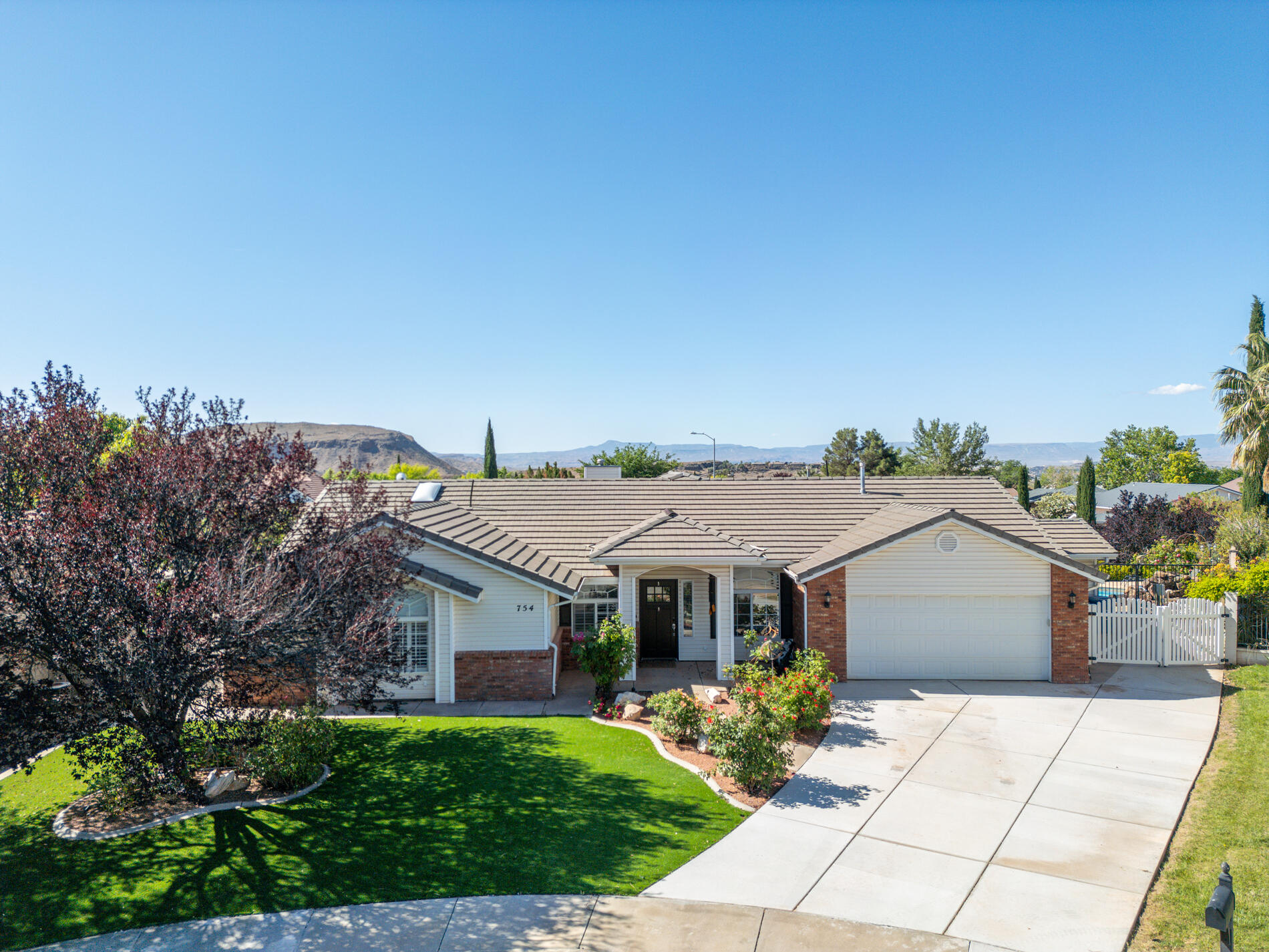 Updated single-level pool home in Spring Hill Estates, tucked at the end of a quiet cul-de-sac in Washington. This is an easy one-story layout with 4 bedrooms plus an office option, 2.5 baths, and about 2,462 sq ft on a flat, usable lot with a private pool and spa. 

Inside you'll find neutral colors, hard-surface counters, and a clean kitchen with stainless gas range, microwave, and dishwasher. The main living area has vaulted ceilings and a gas fireplace, with enough space for a real family room setup instead of just a ''formal'' room. The primary suite includes a separate tub and shower, walk-in closet, and good natural light.

Outside is where this one stands out. You get an in-ground gunite pool with attached spa,  and an exterior half bath so nobody has to drip through the house. The backyard is set up for everyday use, not just photos.

Practical stuff is already in place: attached two-car garage with custom cabinets, storage shed, auto sprinklers, and tile roof. No HOA, and you're close to schools, parks, and amenities in Washington City.

If you're looking for a single-level home with a private pool, a cul-de-sac location, and no HOA, this one should be on your list!