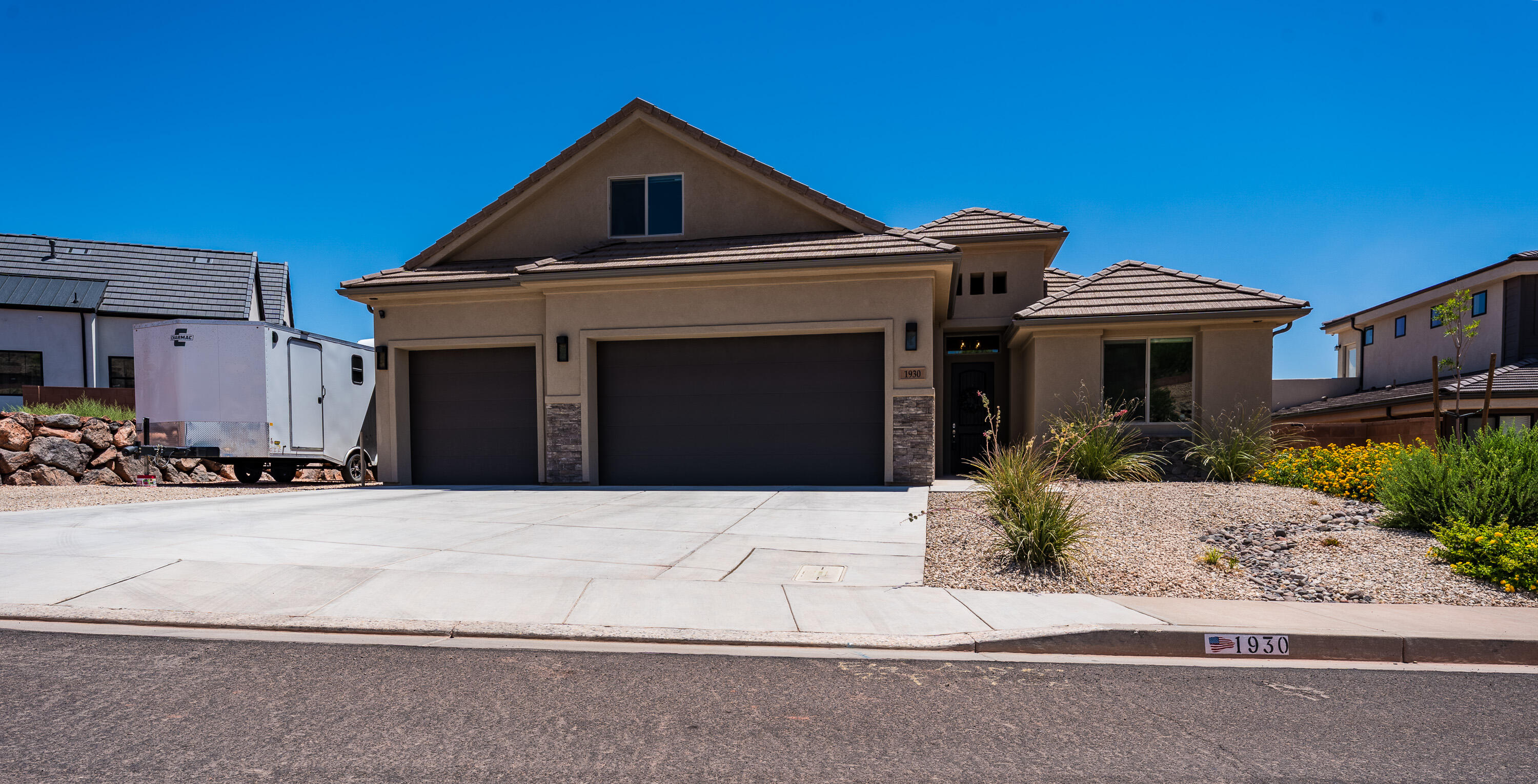 Well-maintained, upgraded home with beautiful backyard views! This home features a spacious kitchen with granite countertops, abundant cabinetry, and a separate pantry--perfect for storage and entertaining. Enjoy a functional, open-concept floor plan with excellent storage throughout. The main level offers 3 bedrooms, 2 bathrooms, and convenient laundry, while the upper level provides a large bedroom, bathroom, and ample closet space--ideal as a private retreat. Stay comfortable year-round with a 3-zone A/C system.

This home also includes a security system with motion lights, door sensors, and cameras, offering added peace of mind. Outside, you'll find a low-maintenance yard and RV parking with full hookups, including 50-amp service--perfect for all your toys and adventures. Located within the sought-after Coral Canyon area, with the added benefit of lower HOA dues in Burke Springs.