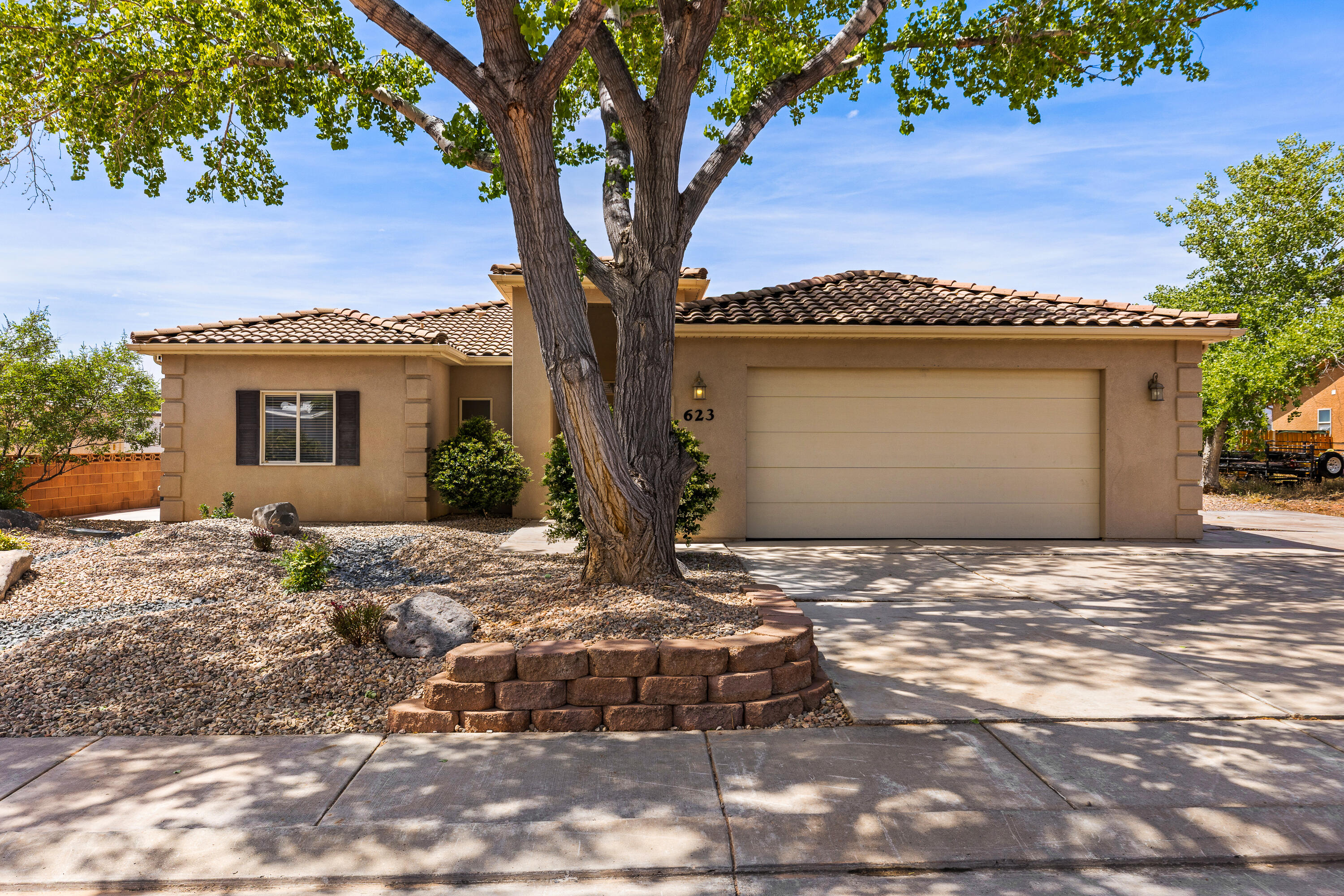 Tucked in a quiet cul-de-sac lot in Zion View Estates, this 3-bedroom, 2-bath single-level home has no HOA and a list of upgrades already done for you. With an owned solar system and xeriscape landscaping, your monthly costs and maintenance stay low from day one. Inside, fresh paint and new LVP flooring give the layout a clean, move-in-ready feel throughout. The attached 2-car garage features extra width, and the RV parking area adds flexibility for toys, trailers, or guests. No dues, no fees, just a solid single-story home in a quiet location with the big-ticket items already taken care of.