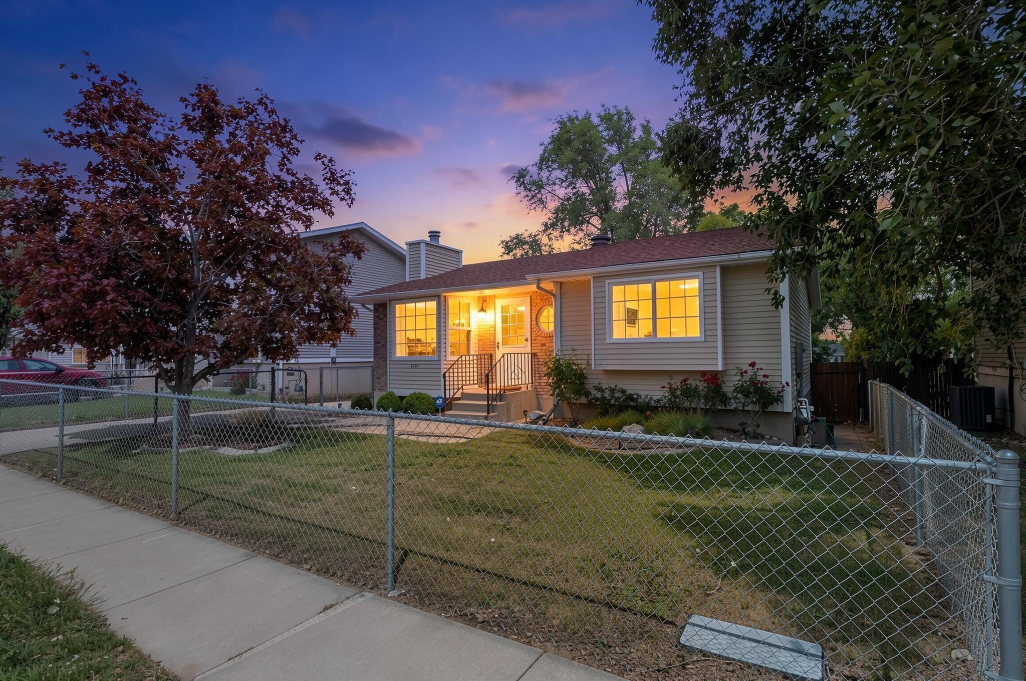 Charming and beautifully updated Taylorsville home featuring a bright modern kitchen with white cabinetry, stainless steel appliances, and stylish finishes throughout. Newer water heater, furnace, and AC installed. Enjoy the spacious backyard complete with a large deck perfect for entertaining, summer BBQs, or relaxing evenings under the mature trees. This home has great curb appeal, a functional, and open layout, and a fully fenced yard with plenty of space to enjoy. Conveniently located near parks, schools, shopping, dining, and freeway access. Move-in ready and full of warmth, NO HOA's. This is a must see!