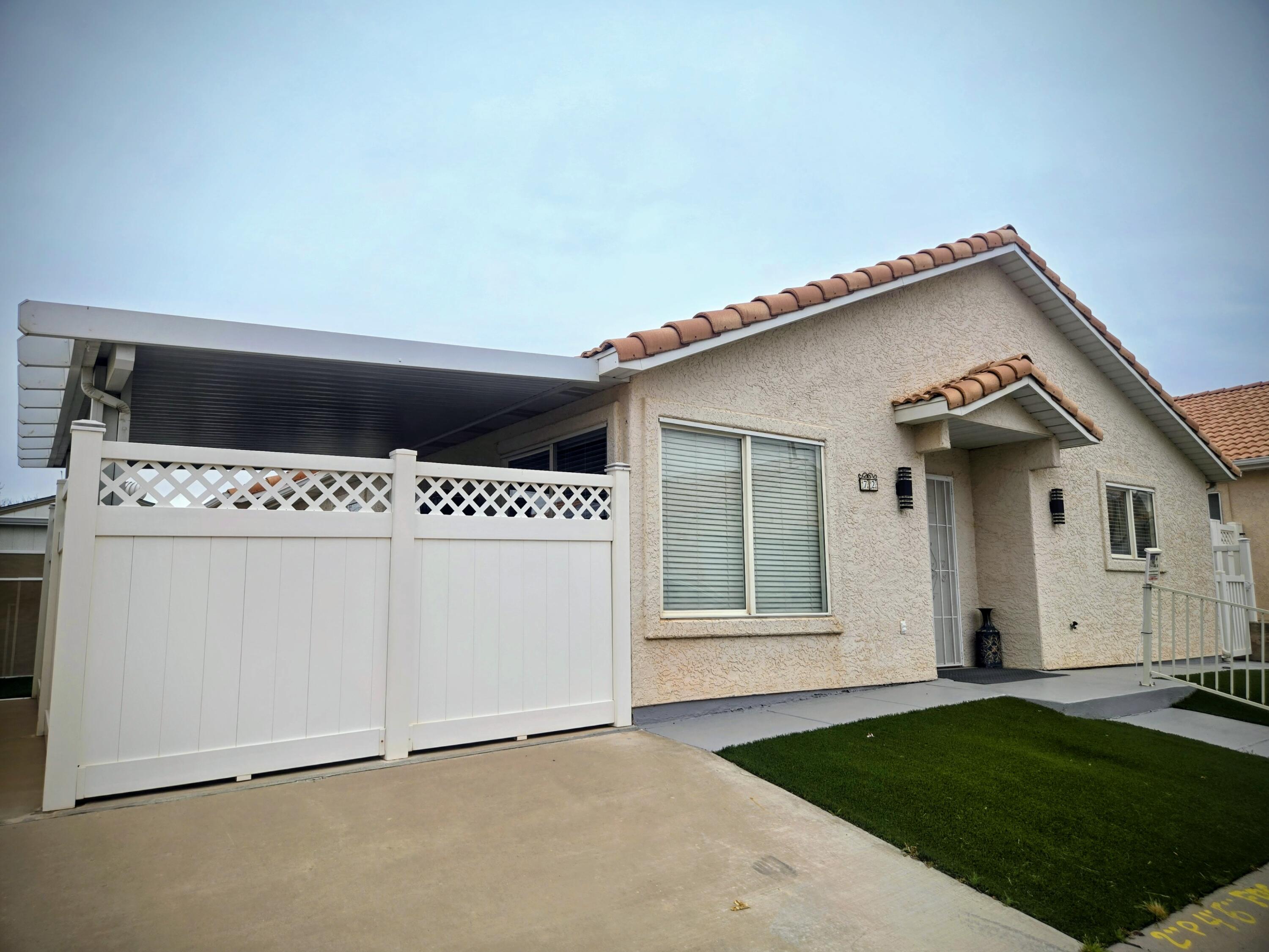 Additional RV Parking on site!  Come see this Spacious Home with 3 Bed Plus Gym/Utility Room, 2 bath home in a desirable 55+ community! Featuring a large, bright kitchen with plenty of natural light, this home also offers a versatile bonus room with its own outdoor entrance--perfect for a gym, craft room, or guest space. Enjoy the private covered patio, RV parking with hookups, and low-maintenance artificial turf. Added upgrades include NEW AC unit with warranty, New Walk in Shower, Lighting, epoxy garage flooring with built-in shelving, and storm doors. Fridge, washer, and dryer are included! With a low HOA and convenient location just minutes from local stores, hospital, and the interstate, this home combines comfort, function, and value.