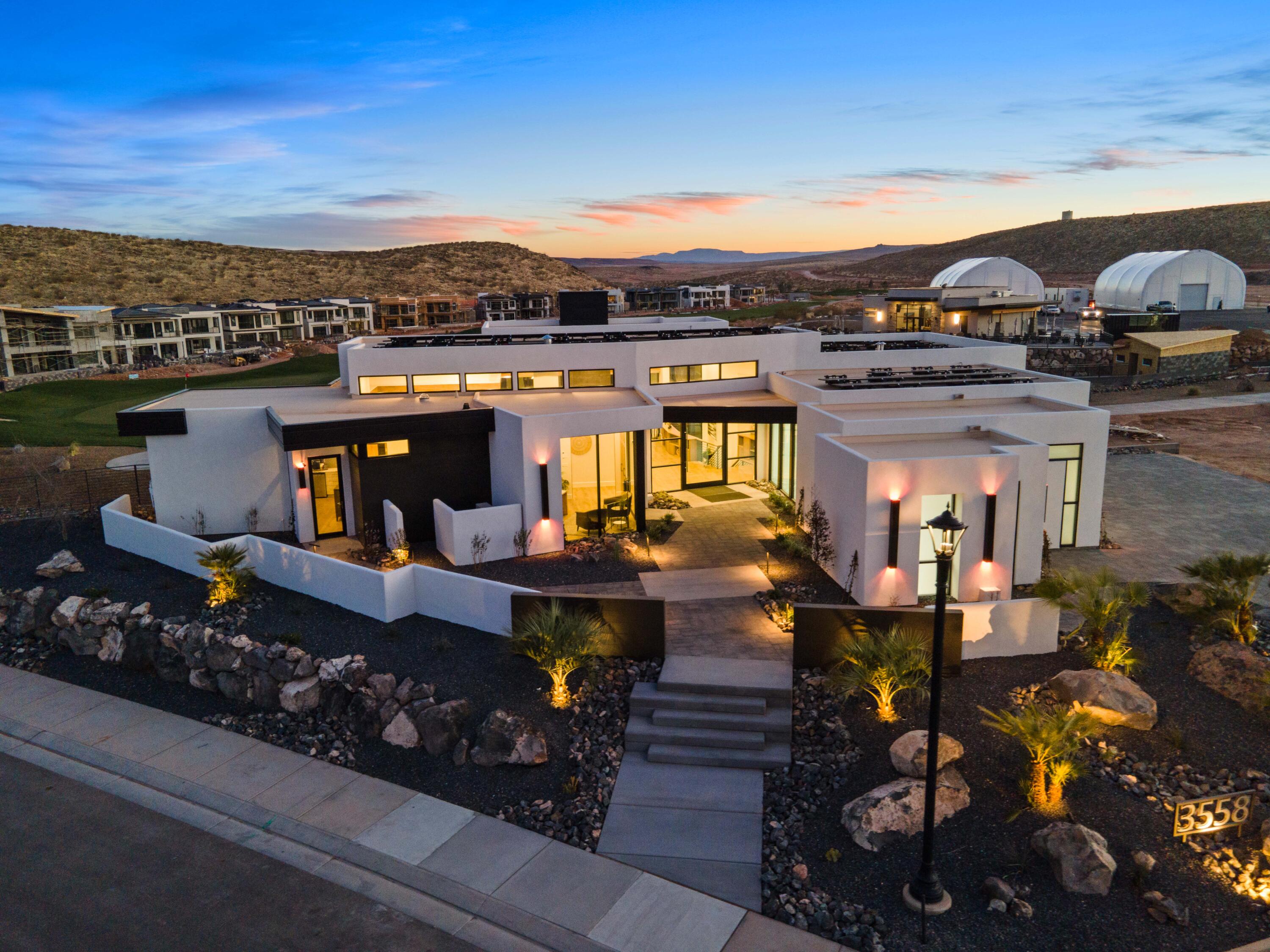 Luxury meets comfort with this beautiful, former Parade of Homes dream home or vacation rental property. Professionally decorated and fully furnished, built by award winning Richardson Brothers Custom Homes. Featuring a fully stocked gourmet kitchen, open and airy floor plan with floor to ceiling windows, large dedicated workspace, attached casita with kitchenette, and two large gathering spaces with additional kitchenette in the basement. Set on Copper Rock Golf Course with stunning views with the Championship 18th hole. An entertainer's dream with an outdoor firepit and BBQ area, heated pool and spa, putting green, and spacious deck and patio spaces. The master ensuite has double sinks, a soaking tub, walk-in shower and closet and private deck. Enjoy quiet nights and views with outdoor sitting on both levels. Basement bedrooms have pool access, and a full additional bathroom is found outside by the pool. Ample parking in the impressive, fully finished 4 car garage. Online bookings boast high guest ratings, currently set up to sleep 14 guests with 4 King beds, 2 Double bunk-beds and sofa sleeper. Close proximity to Zions National Park (30 minutes) and Sand Hollow State Park and Reservoir (15 minutes) for all your hiking, biking, sightseeing, boating, camping, fishing and recreational vehicles wants and needs. All appliances, furniture, decor and household goods are included!