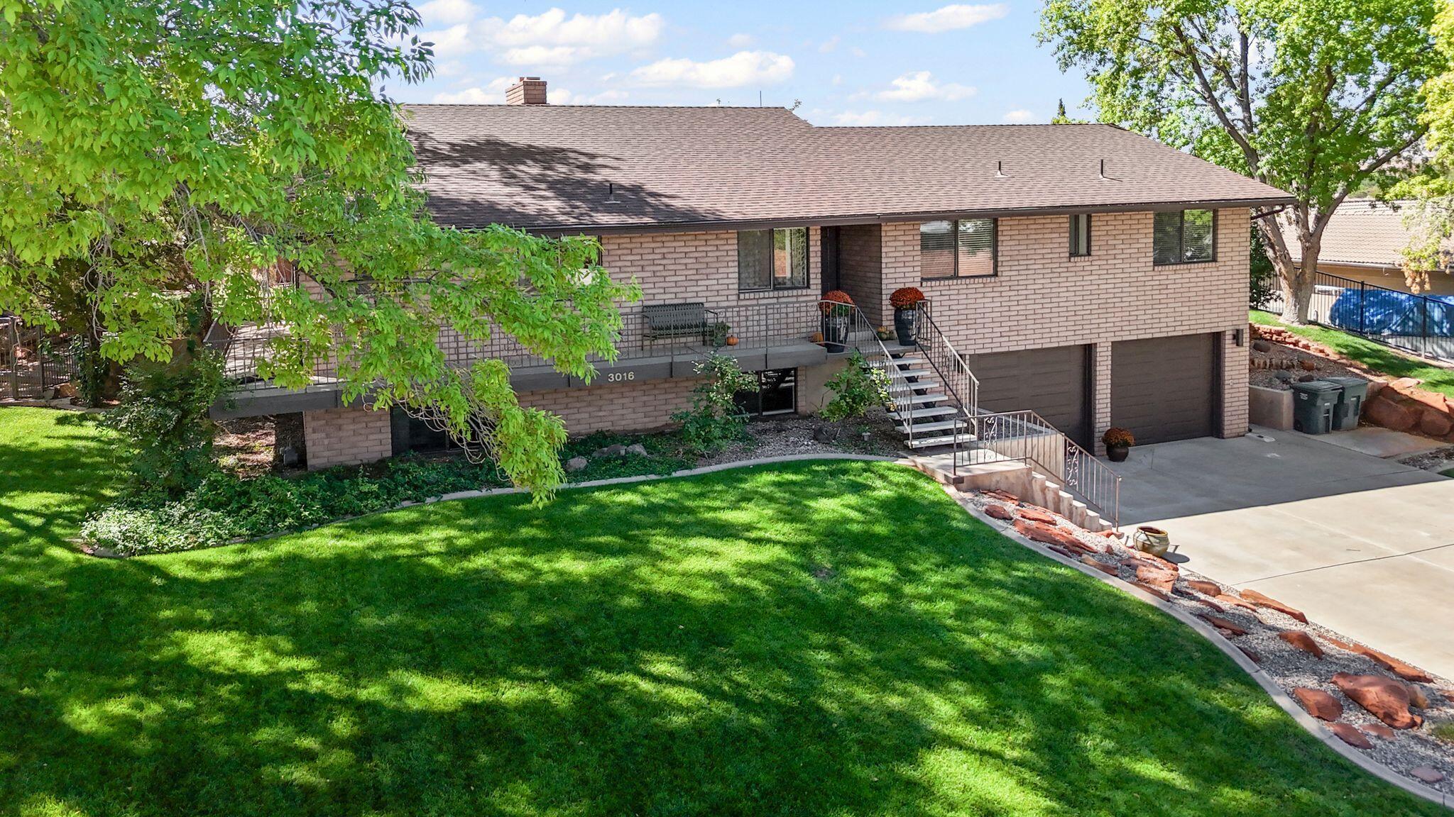 Don't miss this one! Timeless charm meets modern updates in this one-owner custom home nestled on a quiet street near the St. George Golf Course. Built in 1983, this classic, well-crafted residence offers 5 bedrooms, 3.5 baths, and 2 spacious family rooms -perfect for both everyday living and entertaining. Recent improvements include new flooring, carpet, and paint throughout, updated lighting, countertops, and a beautifully remodeled primary bathroom. Enjoy the warmth of three fireplaces, a wrap-around porch, mature shade trees, and abundant storage throughout. With its solid construction, thoughtful updates, and unbeatable location, this home is ready to welcome its next chapter.