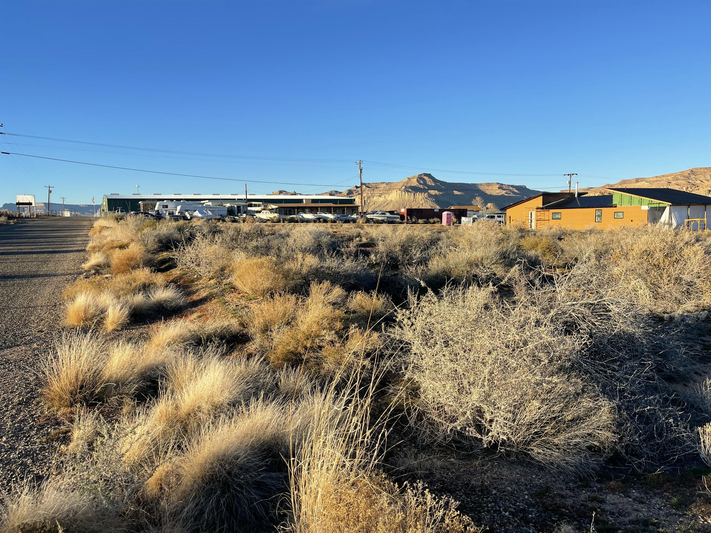 Easy on/off Highway 89 - minutes to Amangari Resort or Lake Powell's natural wonders.  This small subdivision does not have CC&R's + short term rentals are allowed!   3rd price reduction just made!
Easy Build - survey complete, water meter has been paid for and will need to be set when you are ready. Power is in the street.   Big Water provides an environment of many recreation options.  Resident's and guests  enjoy hiking, biking & trail exploration, all from their front door step! 
Are you looking for a building lot that is close to the natural wonders of S. Utah and Lake Powell?  Property zoning allows for single family or manufactured homes.  Priced to Sell!
* Road easement runs along W boundary of property.  See attached survey in photo tab.   Call today for a great home site with all the infrastructure in place!