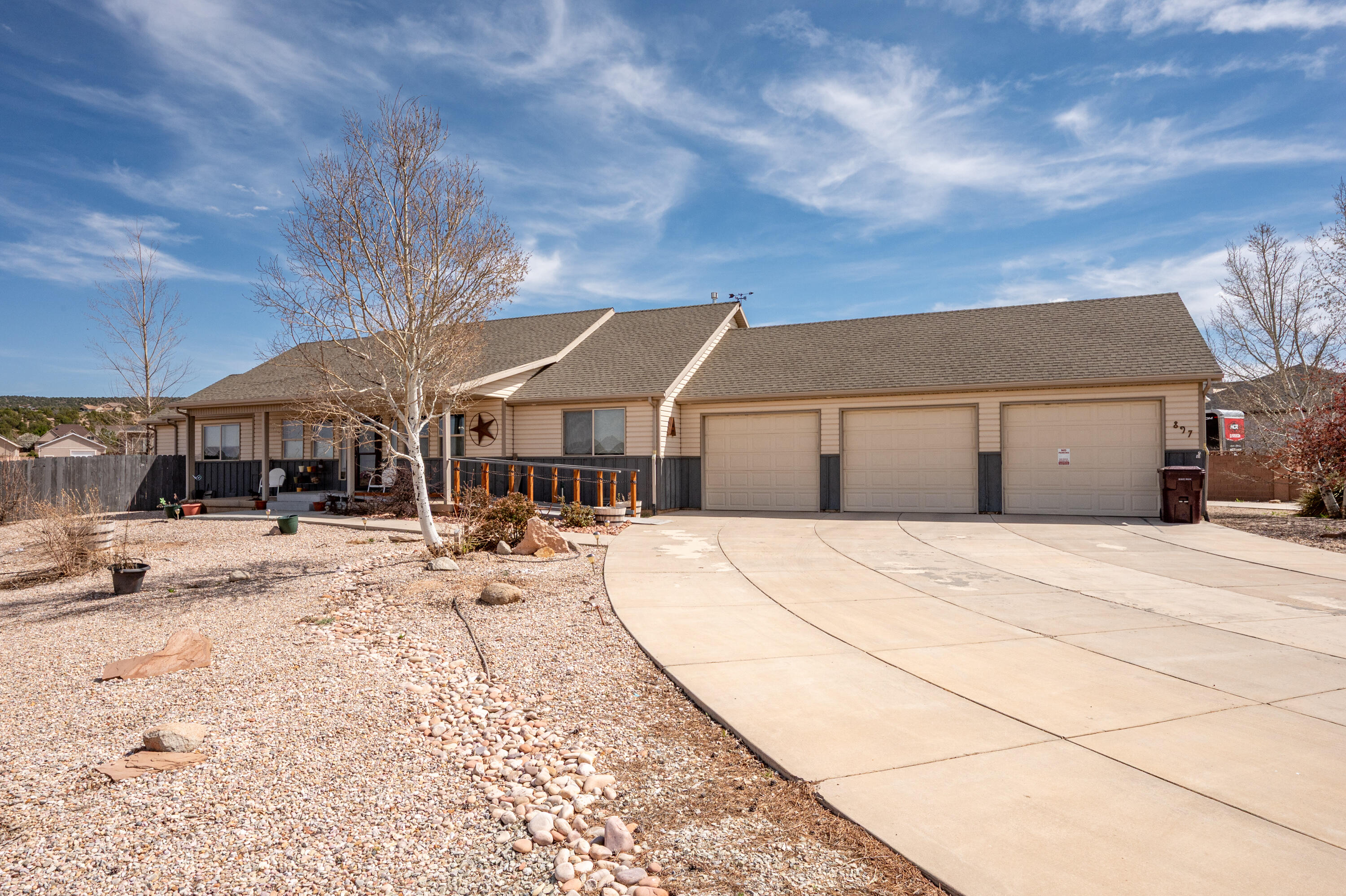 Welcome to easy one-level living in Westview Estates of Cedar City! This 2,200+ sq ft home sits on just over half an acre and checks all the boxes--4 spacious bedrooms, an awesome kitchen, and a cozy fireplace for relaxing nights. The oversized 3-car garage offers great storage, while the exceptional primary suite features sunroom access and an ensuite with dual sinks, soaker tub, walk-in shower, built-in cabinetry, and walk-in closet. The laundry room impresses with abundant cabinetry, sink and the washer and dryer that stay. The inside fridge is included as well! Wheelchair-accessible ramp ensures comfort and safety for years to come. Outside, enjoy a Trex deck, mature fruit trees, garden area, storage shed, full fencing and extra cement with drive-through gate for RV, boat, or toys. Come see this one for yourself! NO SHOWINGS AFTER 6 PM.