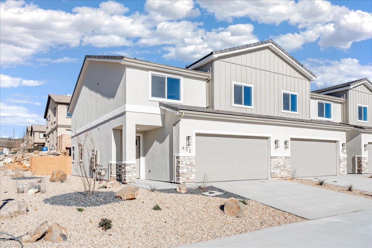 Welcome to this brand-new 4-bedroom, 2.5-bath townhome in the heart of Hurricane, Utah, offering 2,346 sq ft of beautifully designed living space. Thoughtfully upgraded throughout, this home features granite countertops, engineered wood flooring, tile showers and baths that bring both style and durability together. The open-concept layout is perfect for entertaining or everyday living, while the large bedrooms provide comfort and flexibility for family, guests, or a home office.

Enjoy the convenience of a full-size 2-car garage and low-maintenance living with HOA dues of just $100 per month. Ideally located near outdoor adventure, you're just minutes from world-class hiking, biking, and sightseeing at Zion National Park, with easy access to local shopping, dining, and schools. Whether you're looking for a primary residence, second home, or investment property, this move-in-ready townhome delivers modern finishes, generous space, and an unbeatable Southern Utah lifestyle.