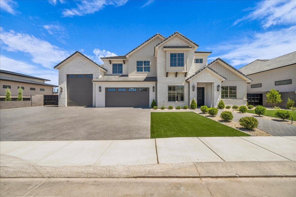 This exceptional 6-bedroom, 5.5-bath custom home offers luxury finishes, breathtaking panoramic red rock and mountain views, and an open-concept floor plan designed for modern living. The chef's kitchen features premium appliances, custom cabinetry, quartz countertops, and an oversized island that flows into the spacious great room with soaring ceilings and a beautiful fireplace. The luxurious primary suite includes a spa-inspired bath with a freestanding tub, oversized walk-in shower, and generous walk-in closet. Enjoy resort-style outdoor living with a private pool, covered patio, and upper viewing deck perfectly positioned to capture the incredible views. Complete with an oversized RV garage and designer finishes throughout, this home is an exceptional blend of luxury, comfort, and Southern Utah living. Reach out to schedule a showing today!